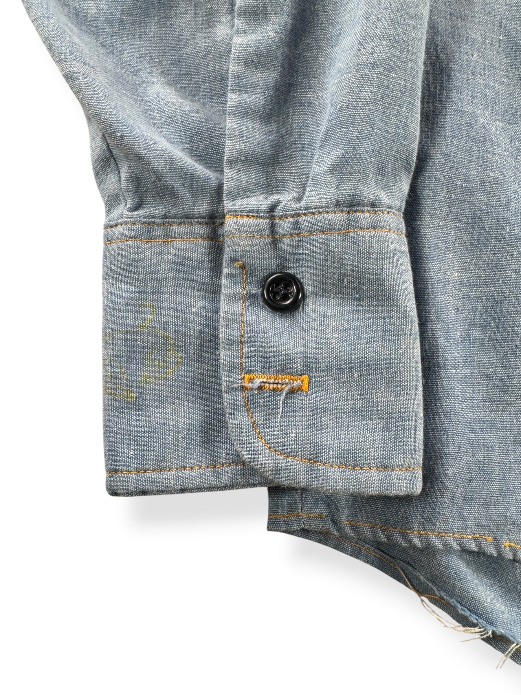 Close up of missing button on wrist of Vintage 70s Embroidered Chambray Shirt
