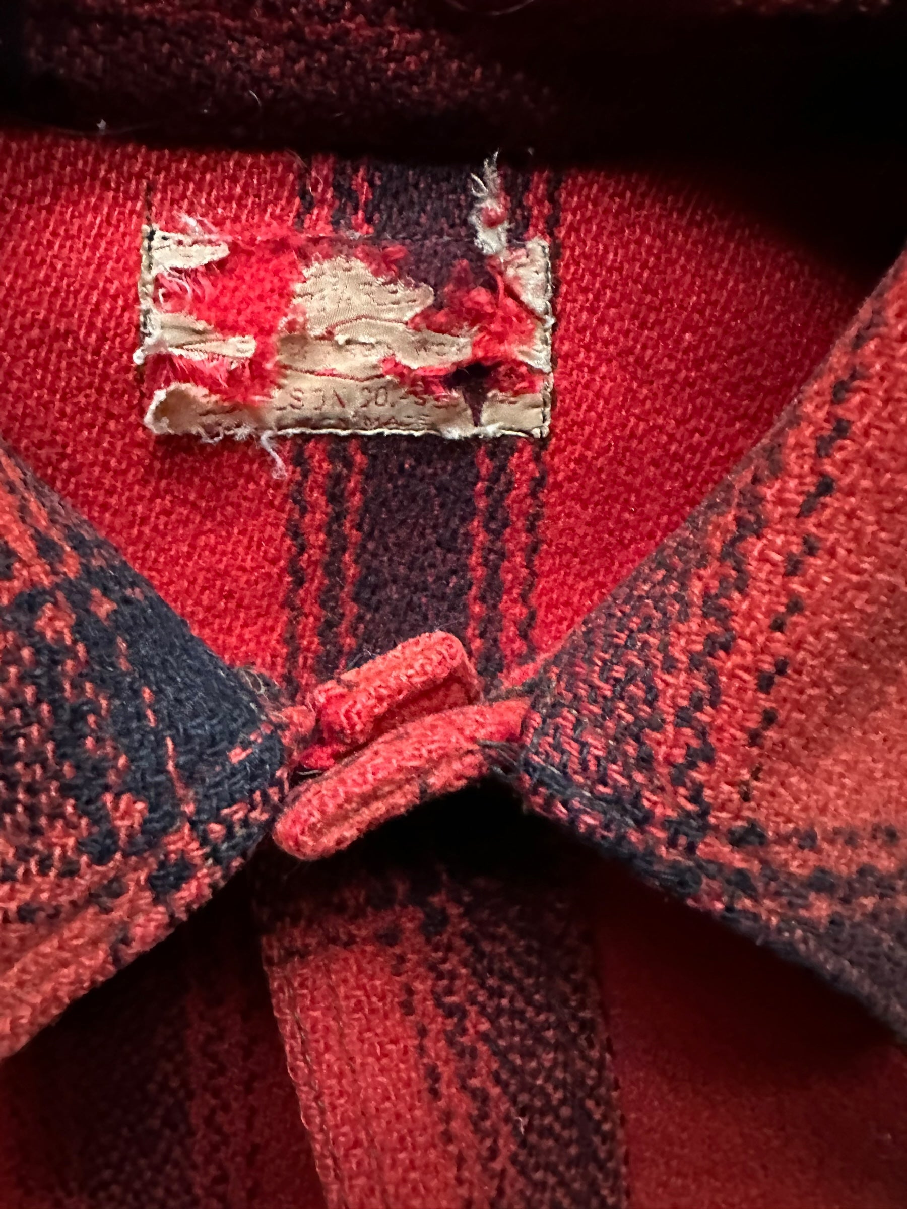 Shredded Tag View of Vintage 75% Red Filson Hunter Wool Jacket SZ 44 | Vintage Filson Workwear Seattle | Vintage Workwear Seattle