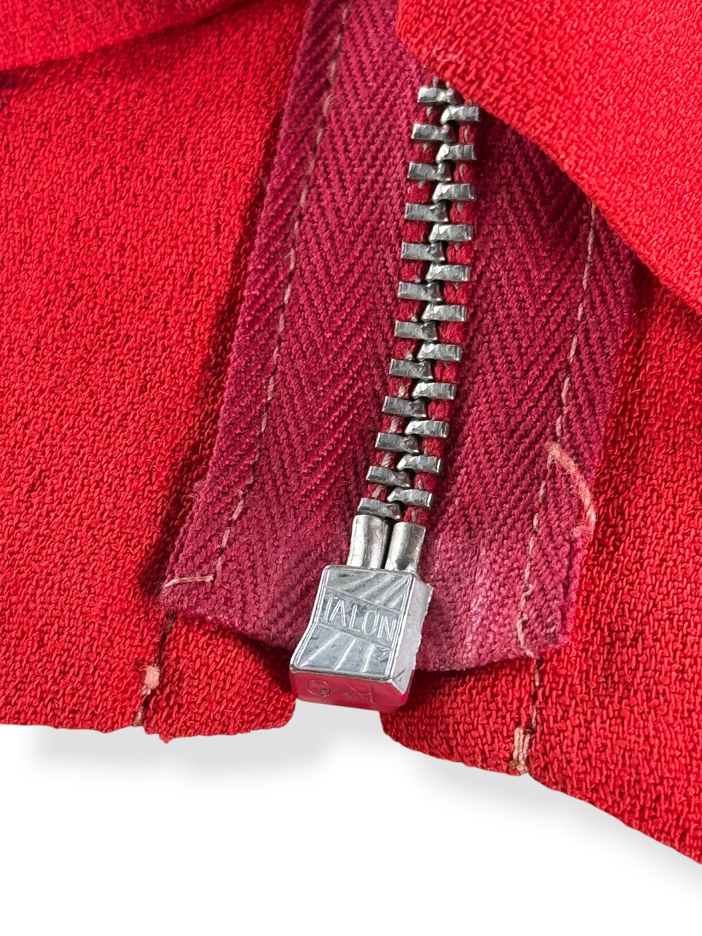 Botton of Talon zipper on Vintage 1940s Red Rayon Blouse W/ Beadwork SZ XS
