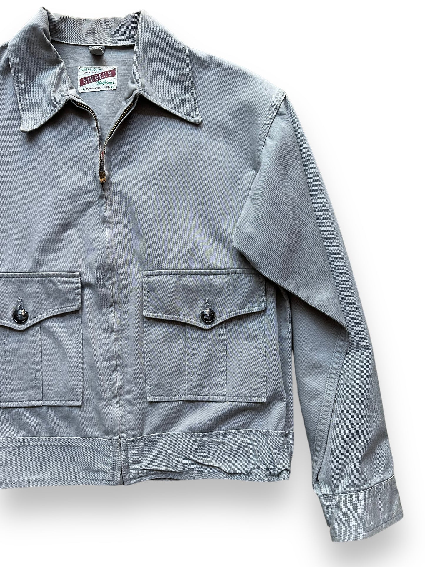 Front Left View of Vintage Grey Chainstitched Siegels Uniform Workwear Jacket SZ M | Vintage Workwear Seattle | Barn Owl Vintage Goods