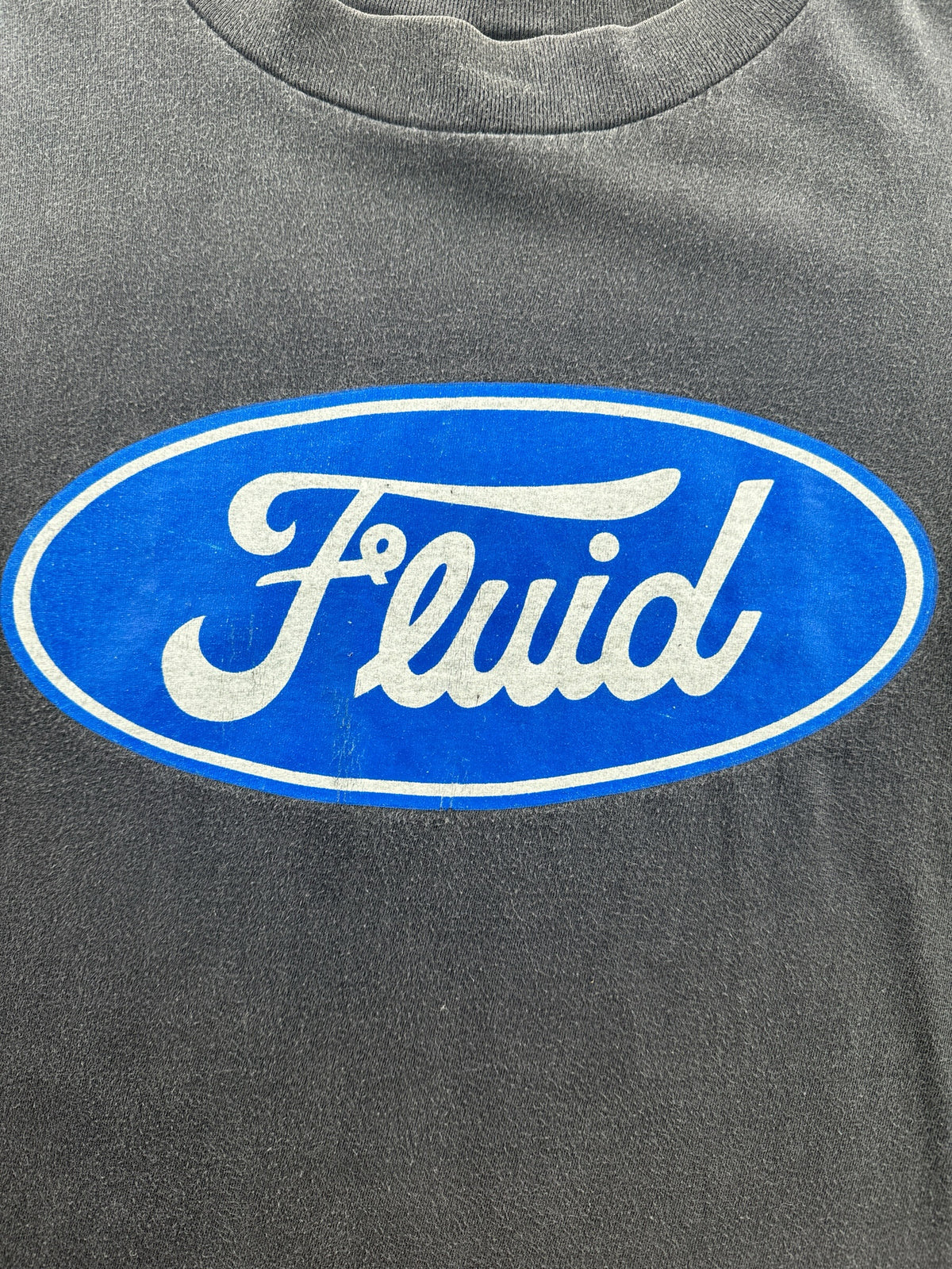 Front graphic on Vintage 90s Fluid Volume Is Job 1 Tee SZ XL