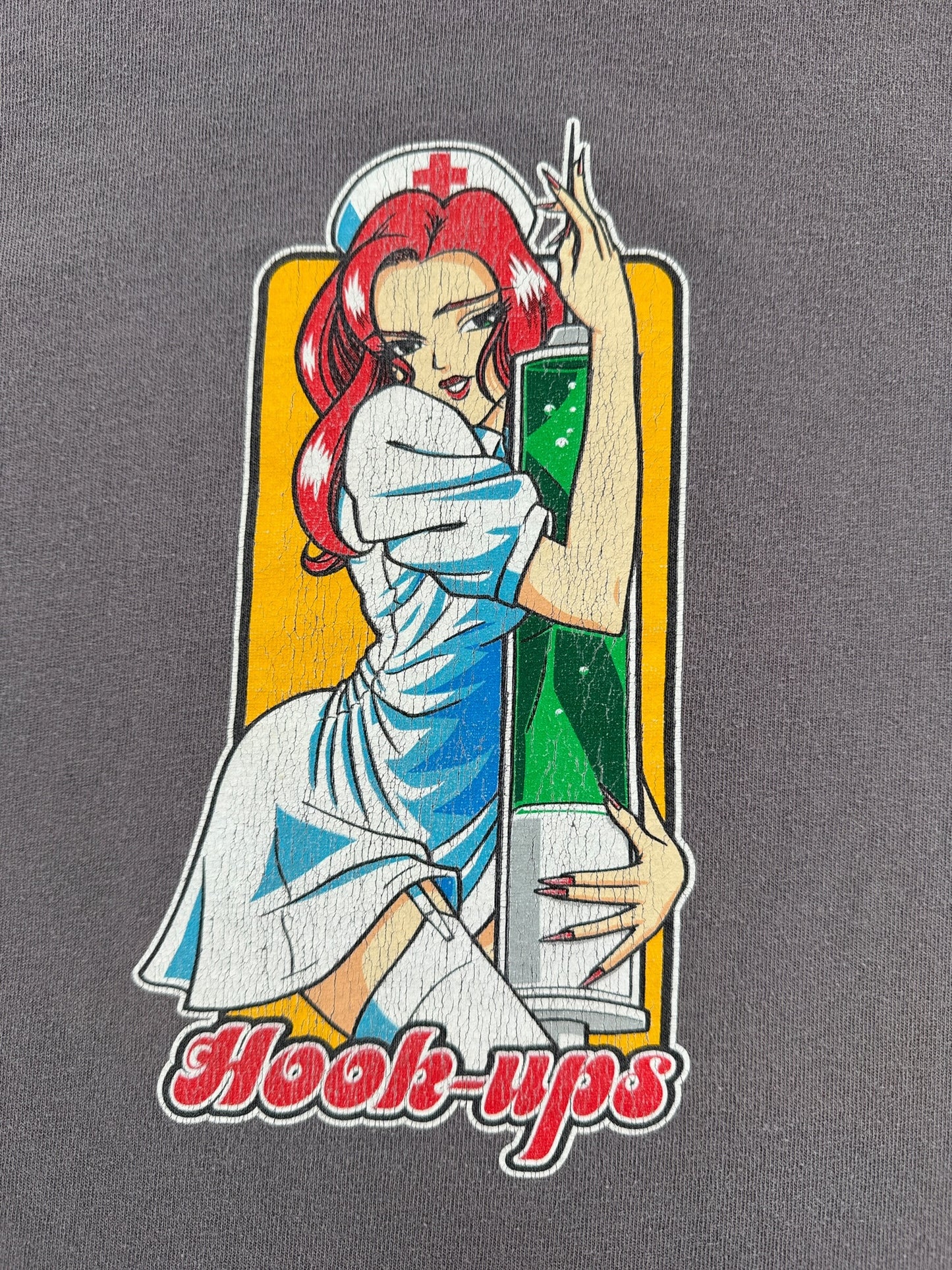 Graphic of Vintage Hook-Ups Nurse Mika Needle Tee SZ L