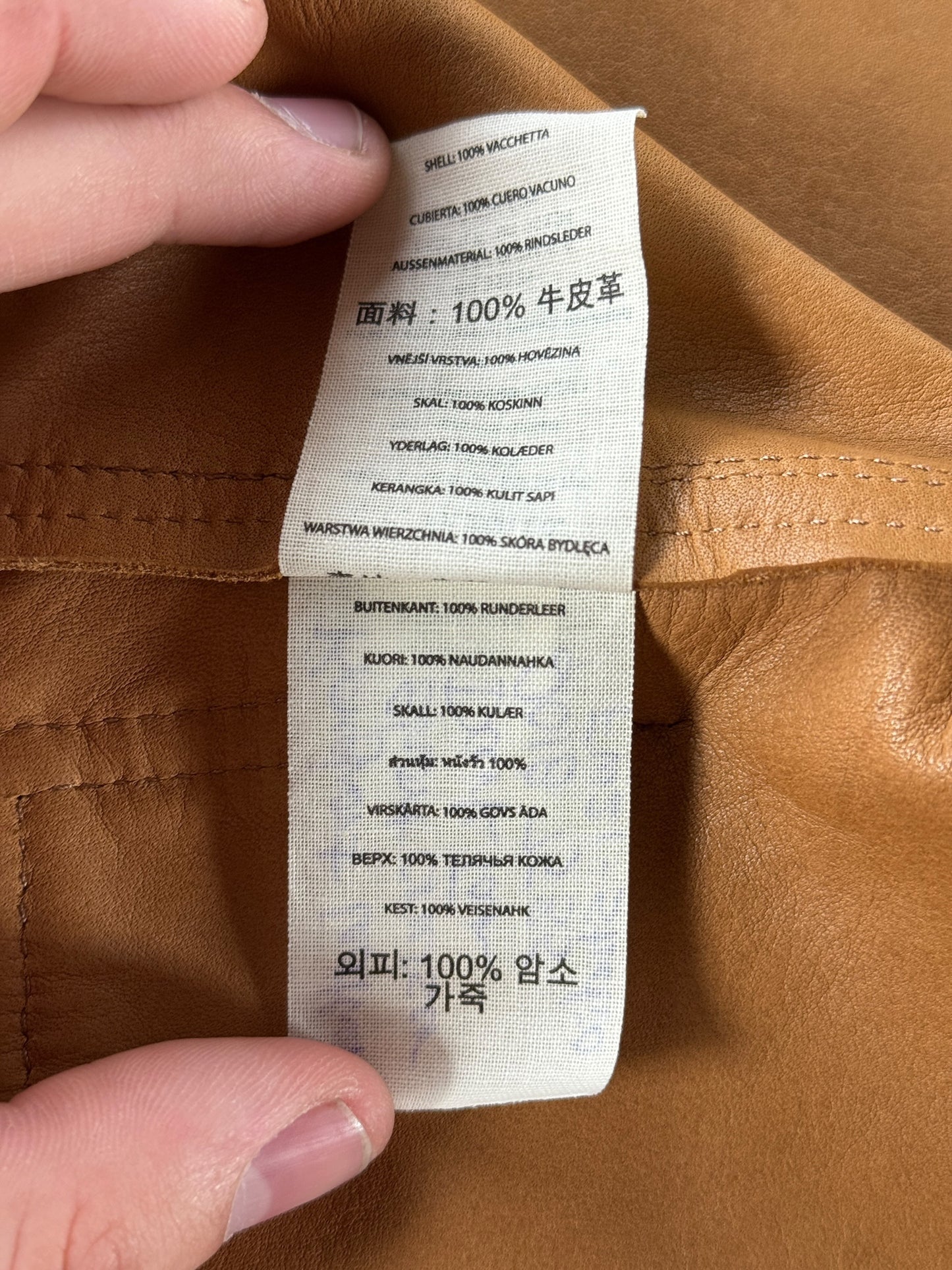 Material Tag on Filson Dark Tan Roughout Leather Short Cruiser SZ M