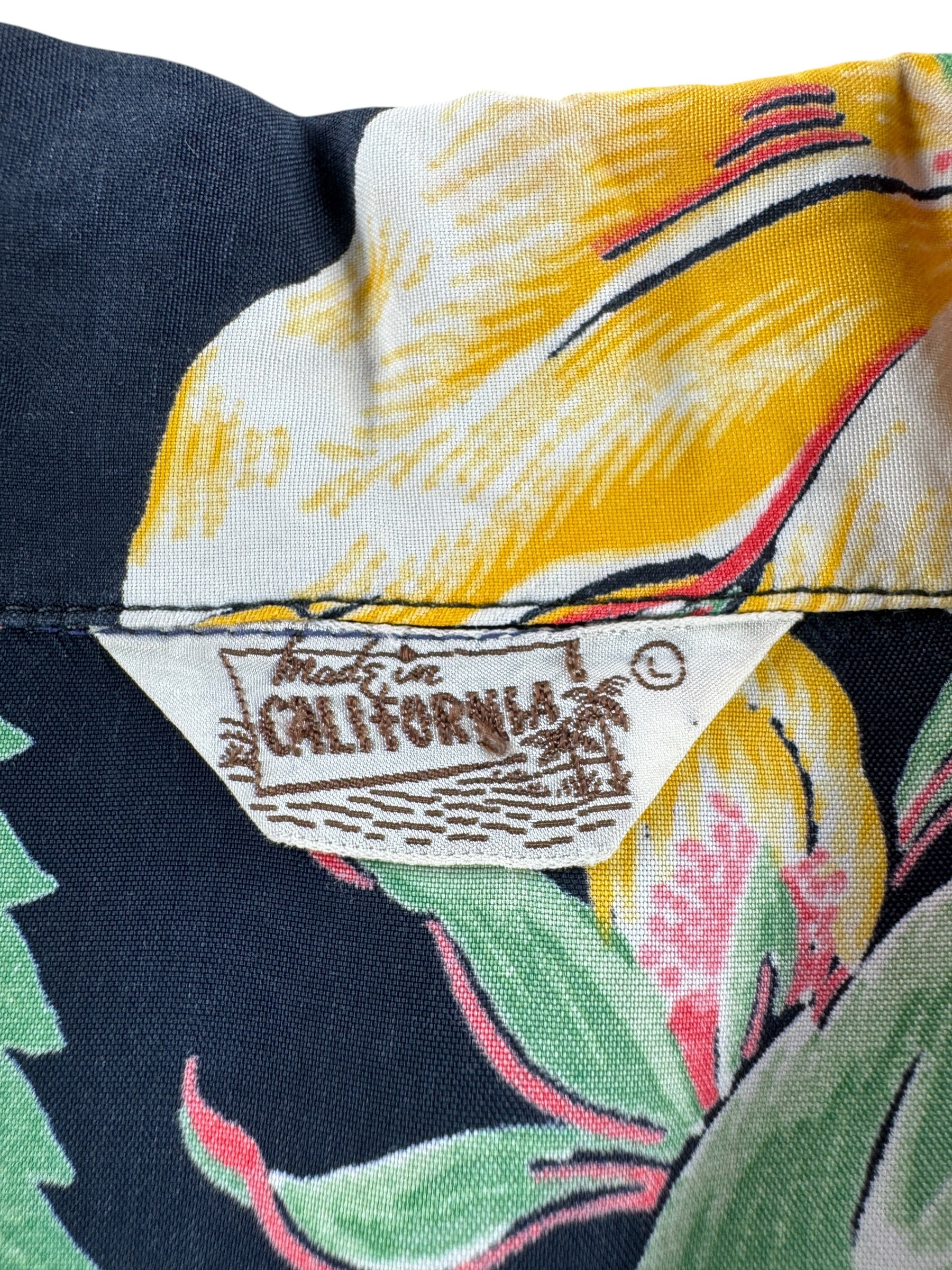 Label on Vintage Black Made in California Floral Rayon Aloha Shirt SZ L (Fits M)