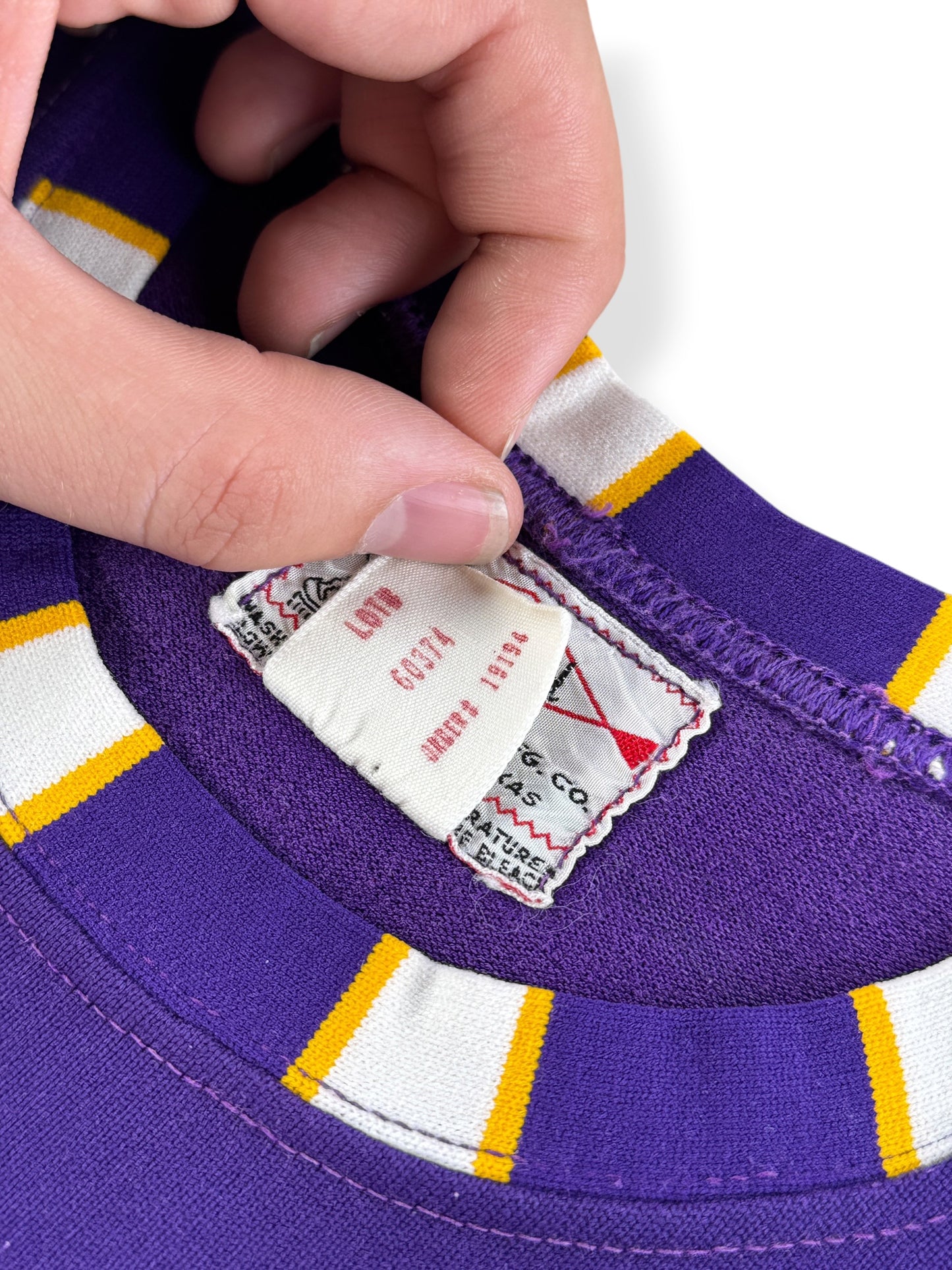 Back of size tag on Vintage Southland "2" Purple Tank Top Jersey SZ L (Fits M)