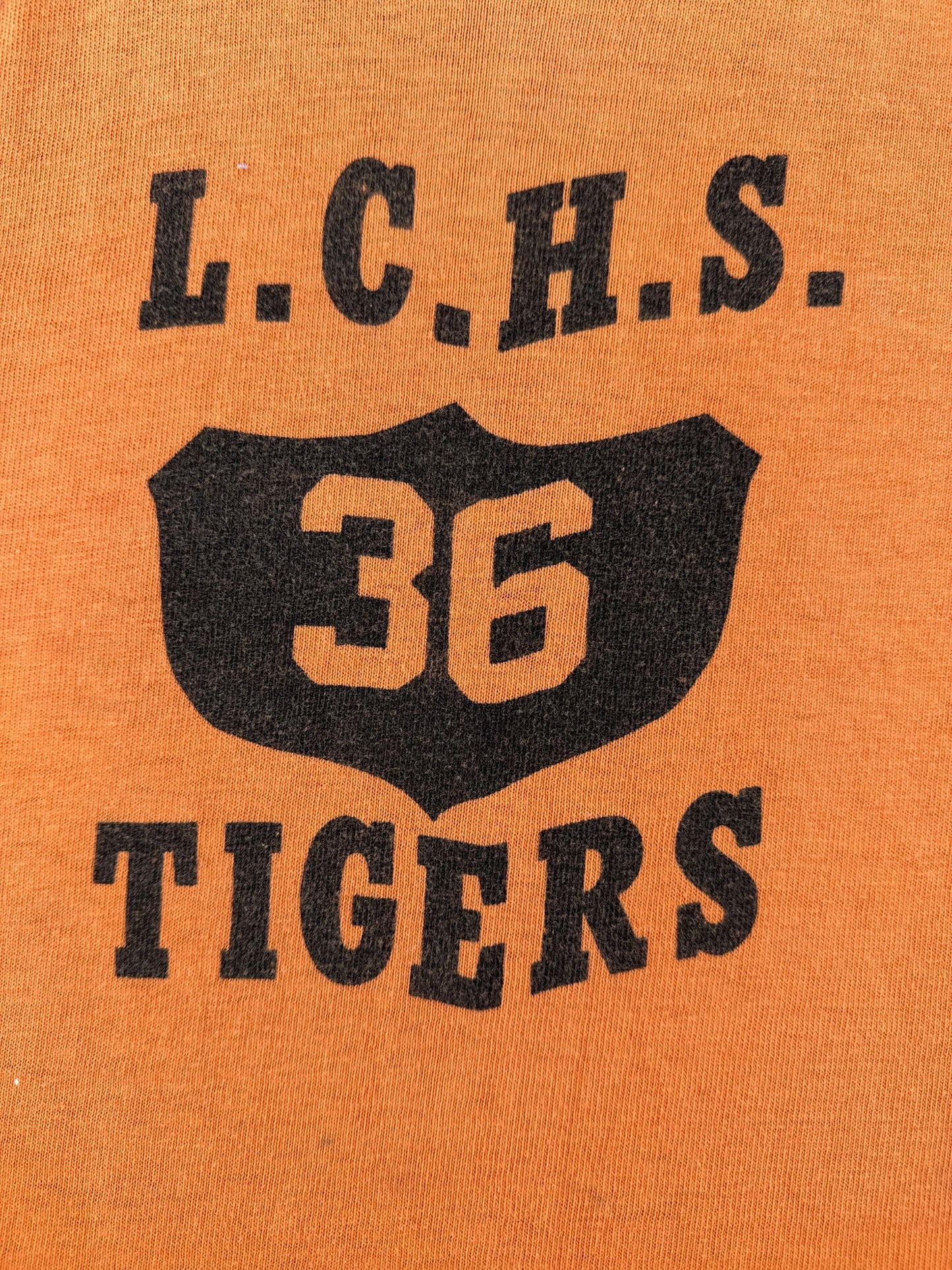 Front graphic on Vintage 1960s Faded Orange LCHS Tigers Tank Top SZ M (Fits S)