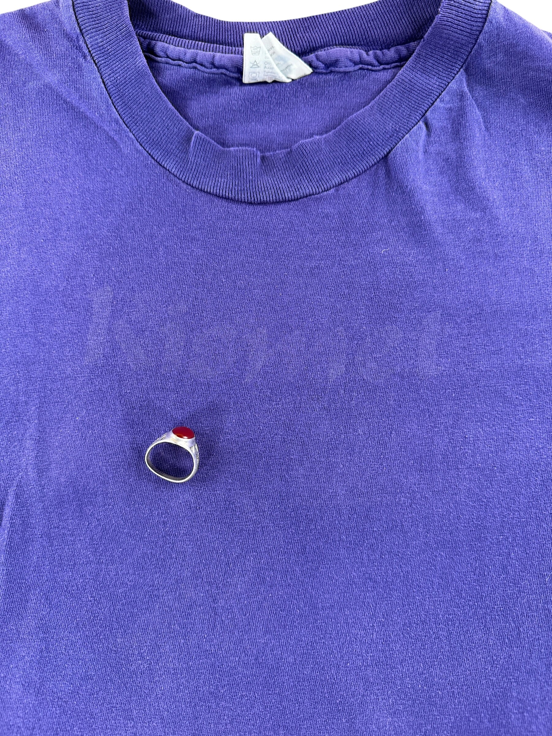 Faded Kismet logo on front of Vintage Purple Kismet Tee SZ L