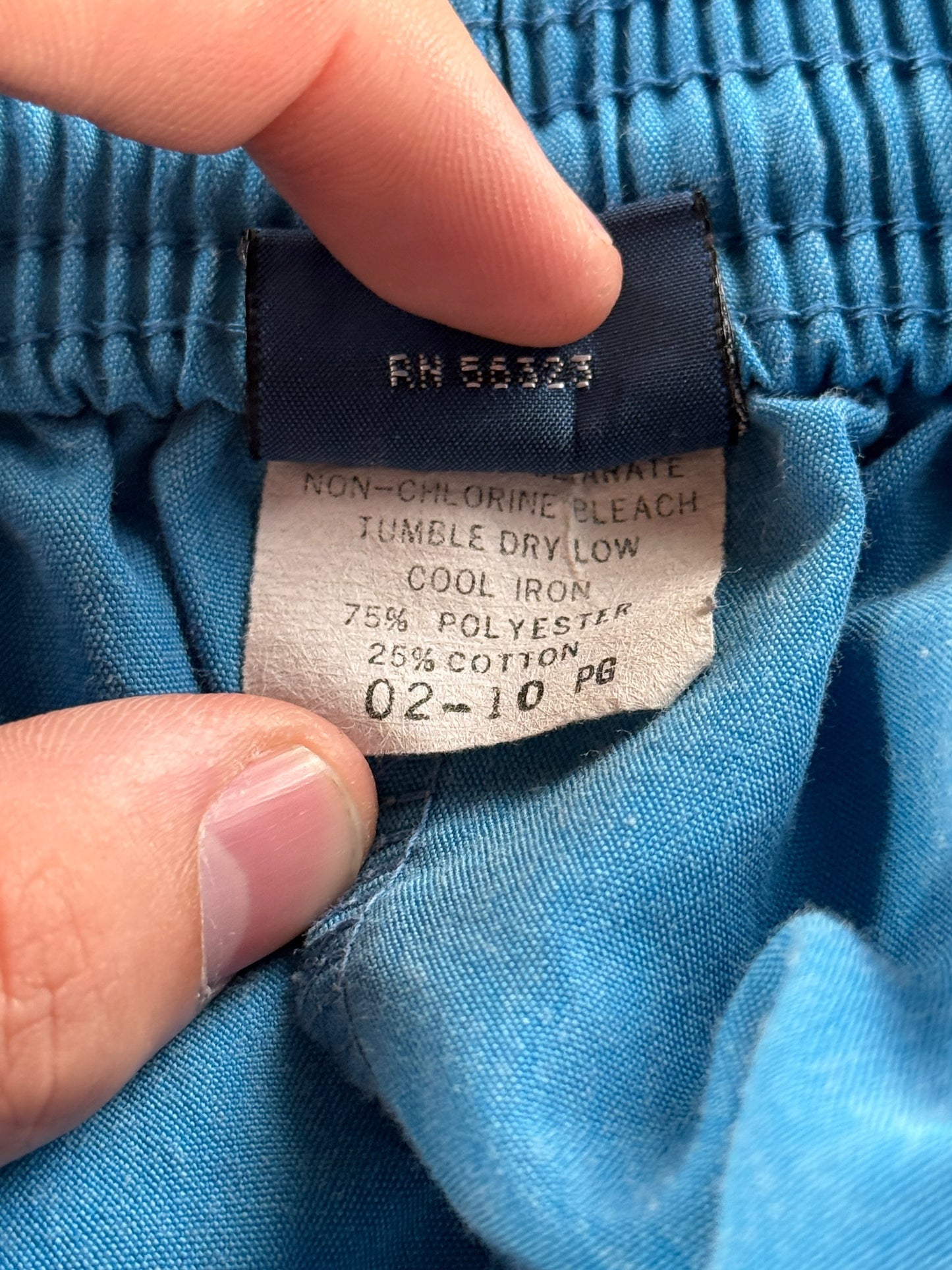 Care Tag on Vintage 80s Blue Nike Shorts SZ L