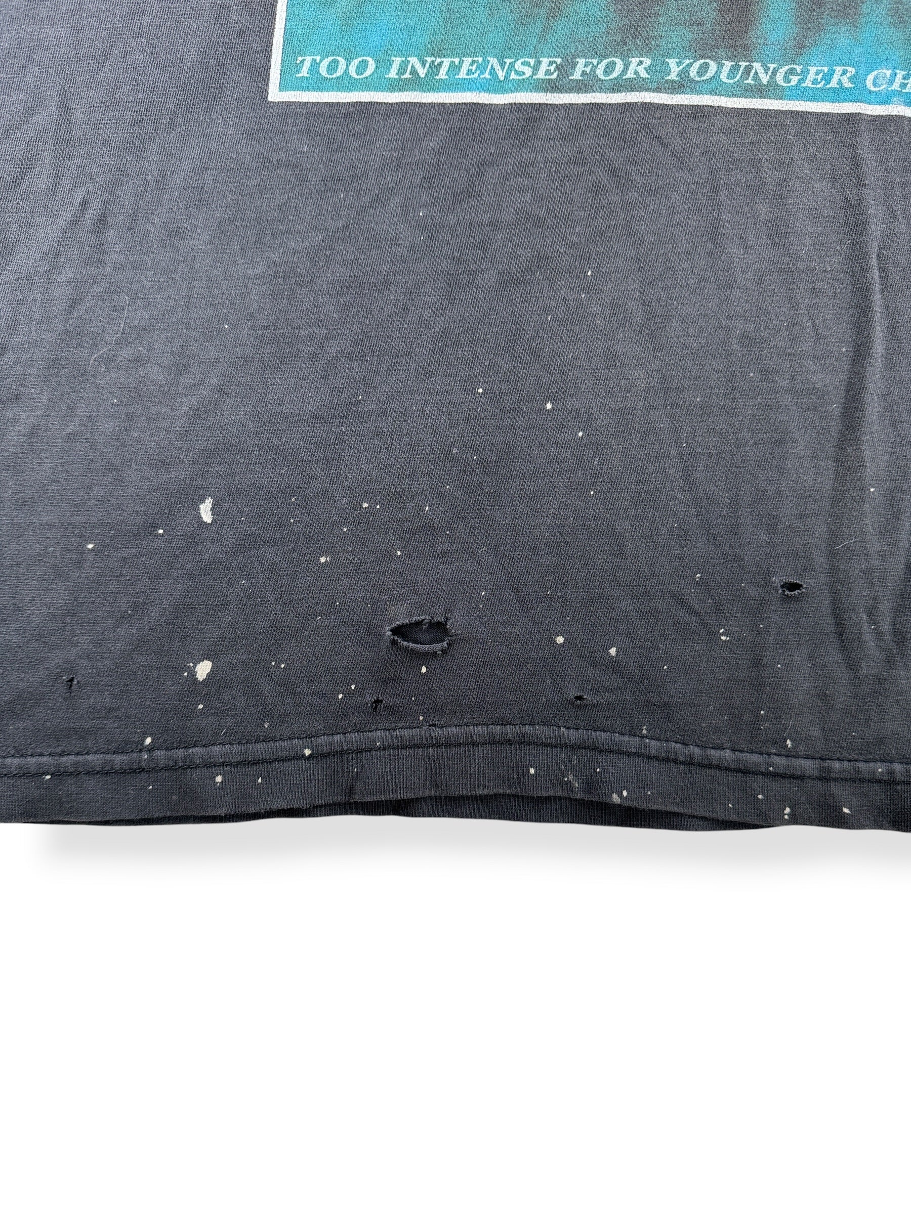 Holes and paint splatter on bottom of Vintage 2002 Distressed Ozzy Jaws Tee SZ L