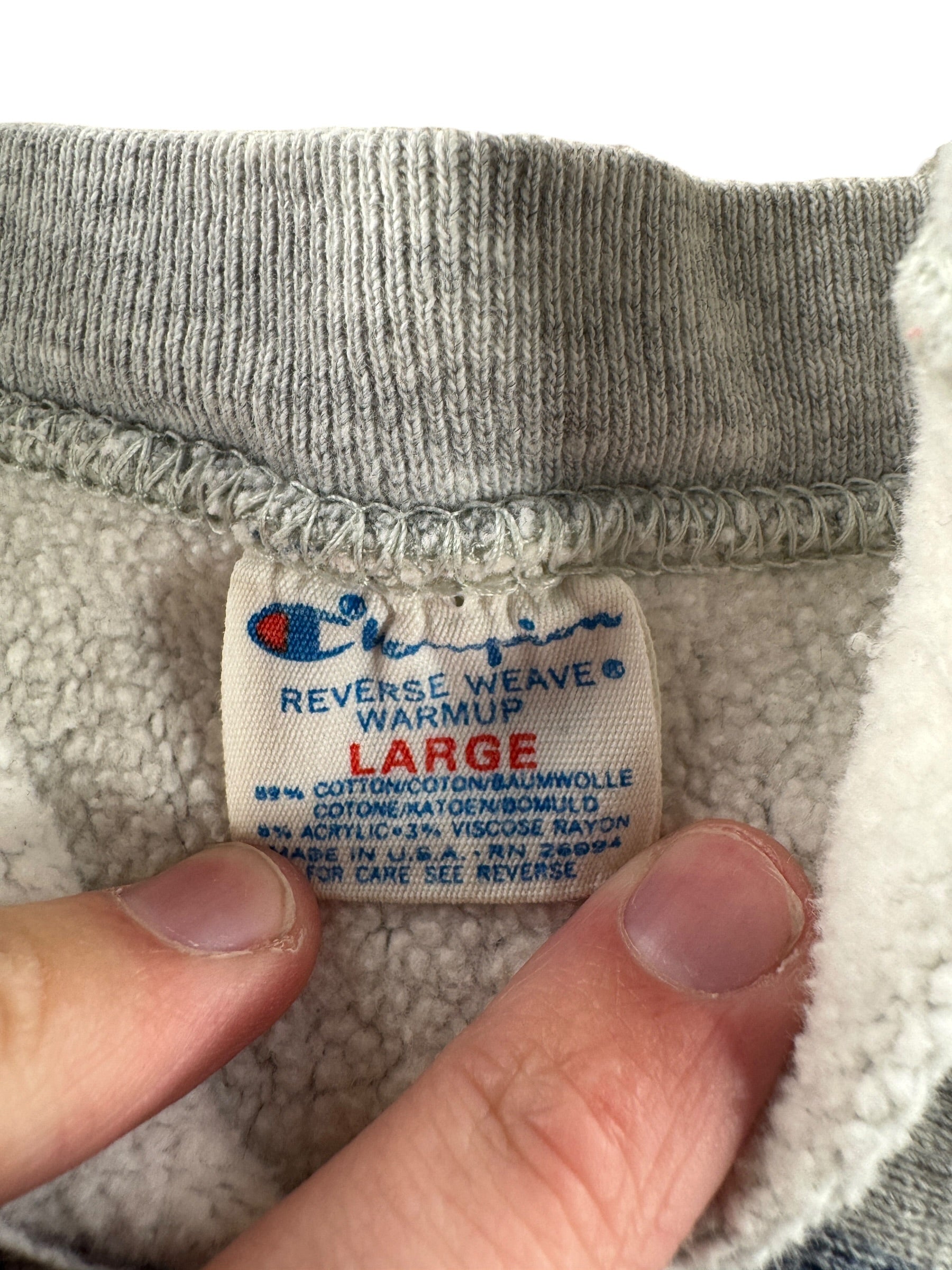 Tag on Vintage 80s Thrashed Frat Champion Reverse Weave Crewneck SZ L