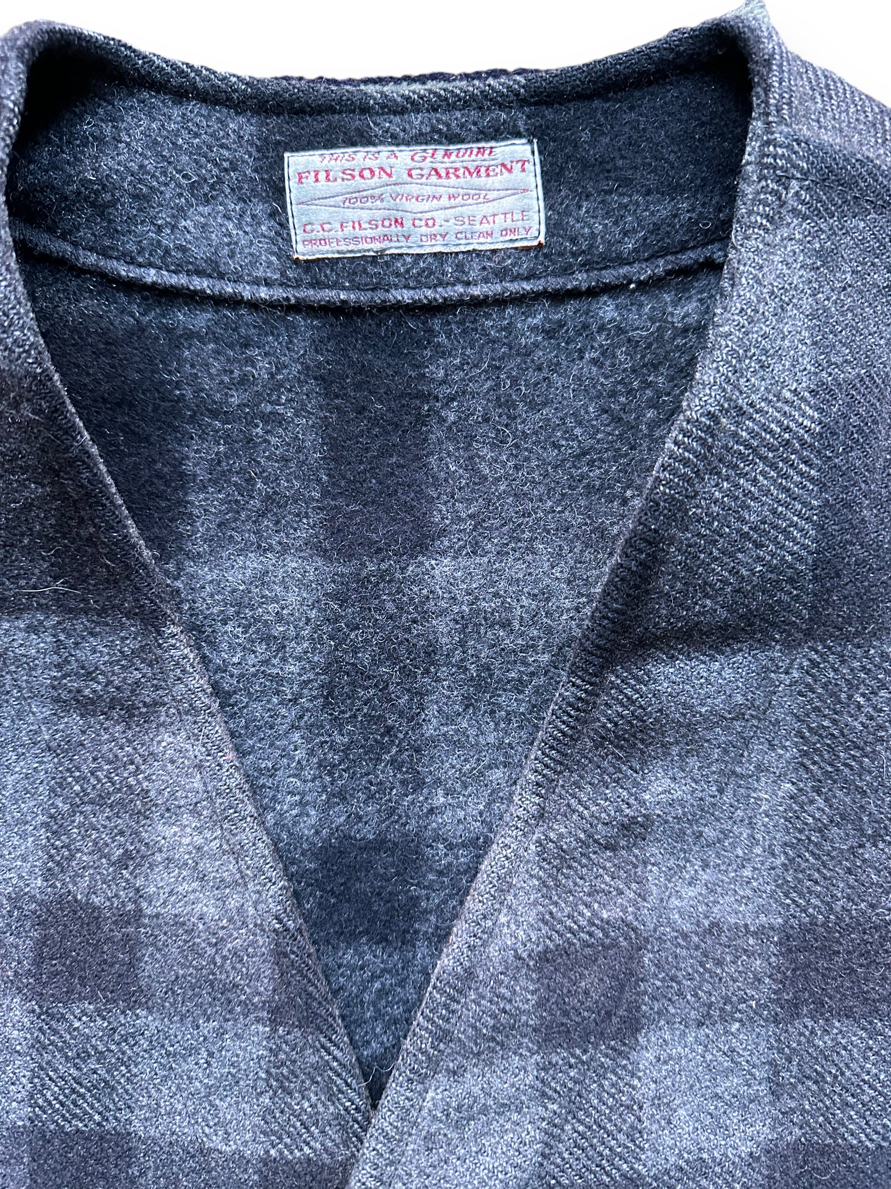 Tag Close Up on Vintage Sun Faded Filson Charcoal & Black Mackinaw Vest SZ 40 |  Vintage Filson Workwear Seattle | Barn Owl Vintage Clothing Seattle