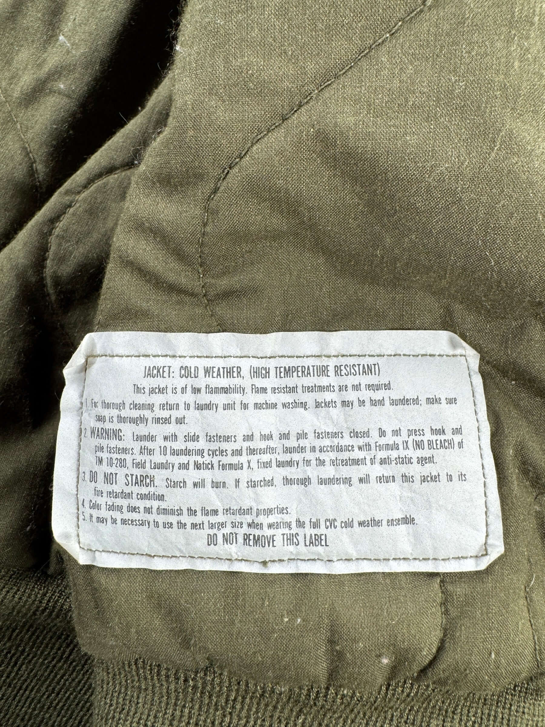 Care Tag on Vintage 90s Era 2nd Infantry Cold Weather Flyers Jacket SZ L Long