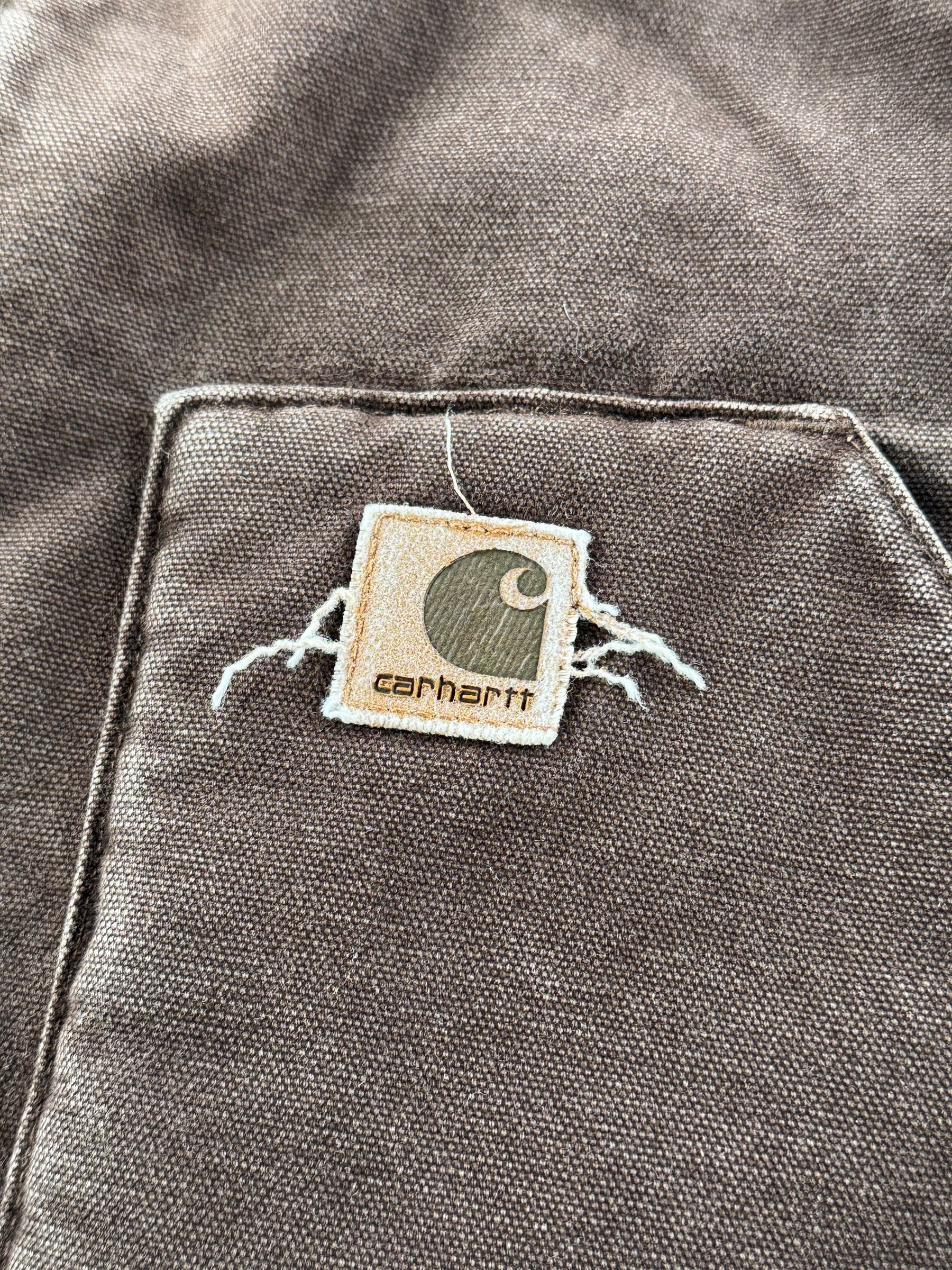 Label on pocket of Carhartt Brown Vest SZ L