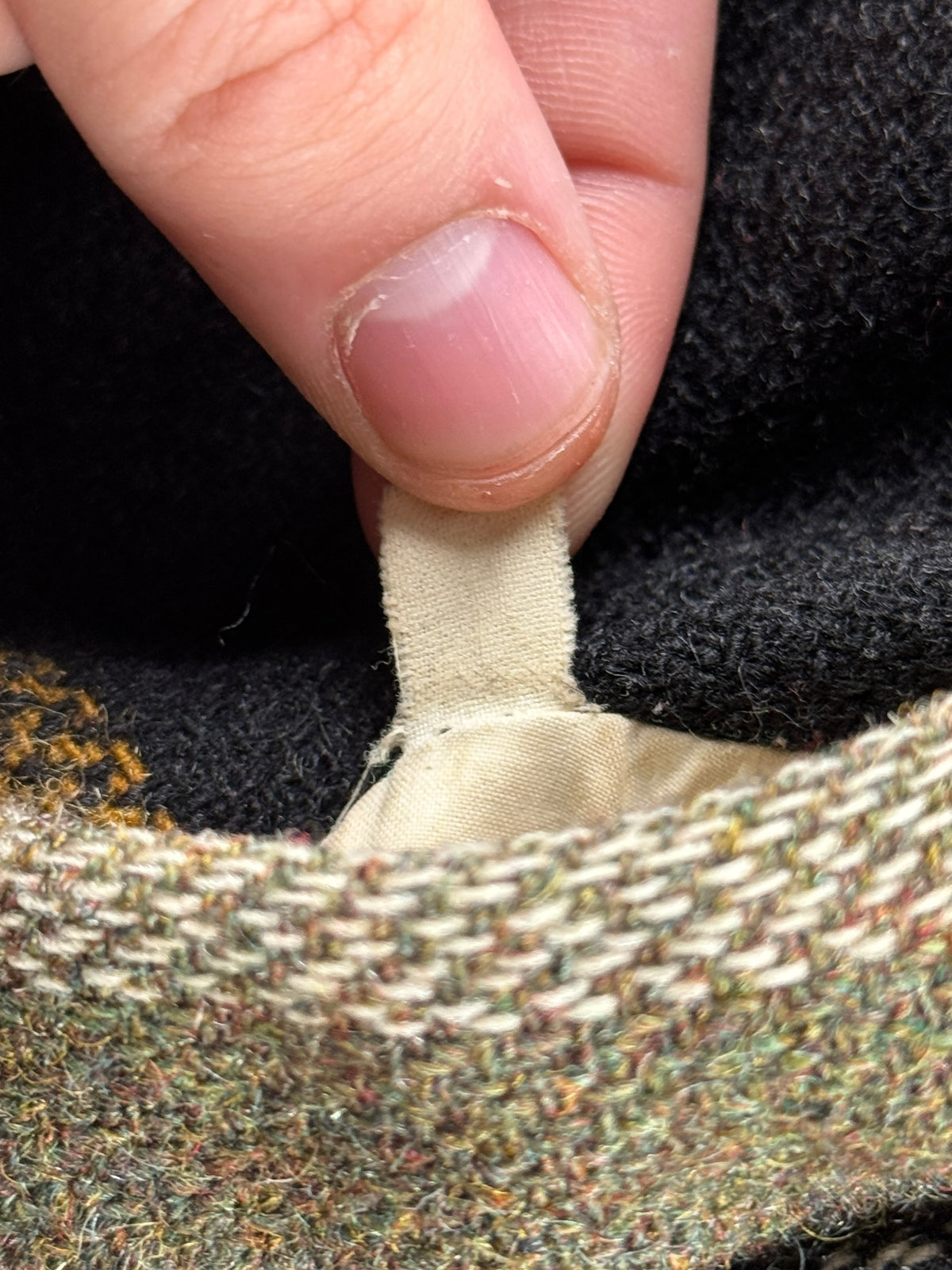 Tag inside pocket of Vintage 60s/70s Fleece Lined Wool Jacket SZ L