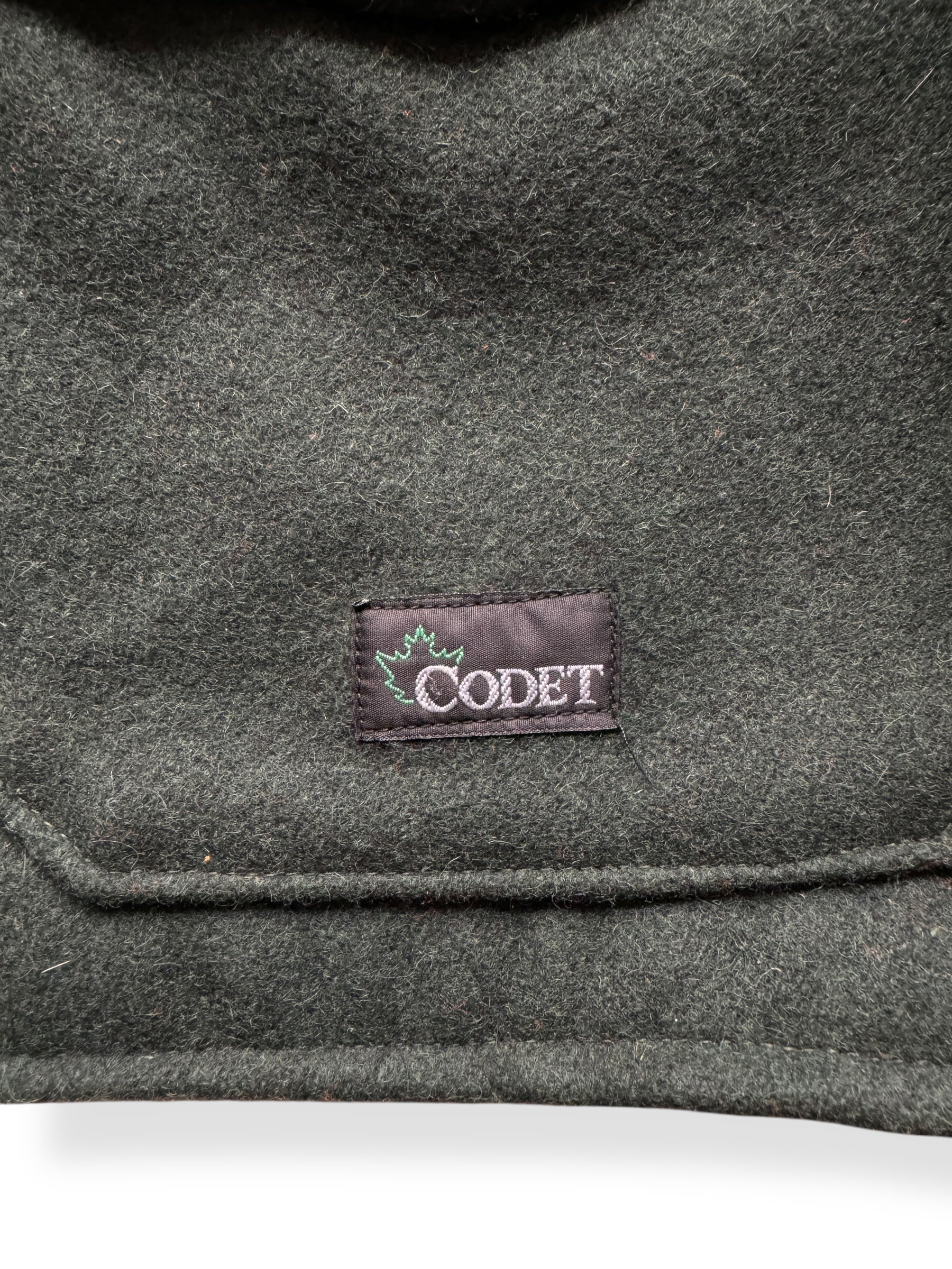 Label on Codet Green Wool Hunting Jacket SZ XL