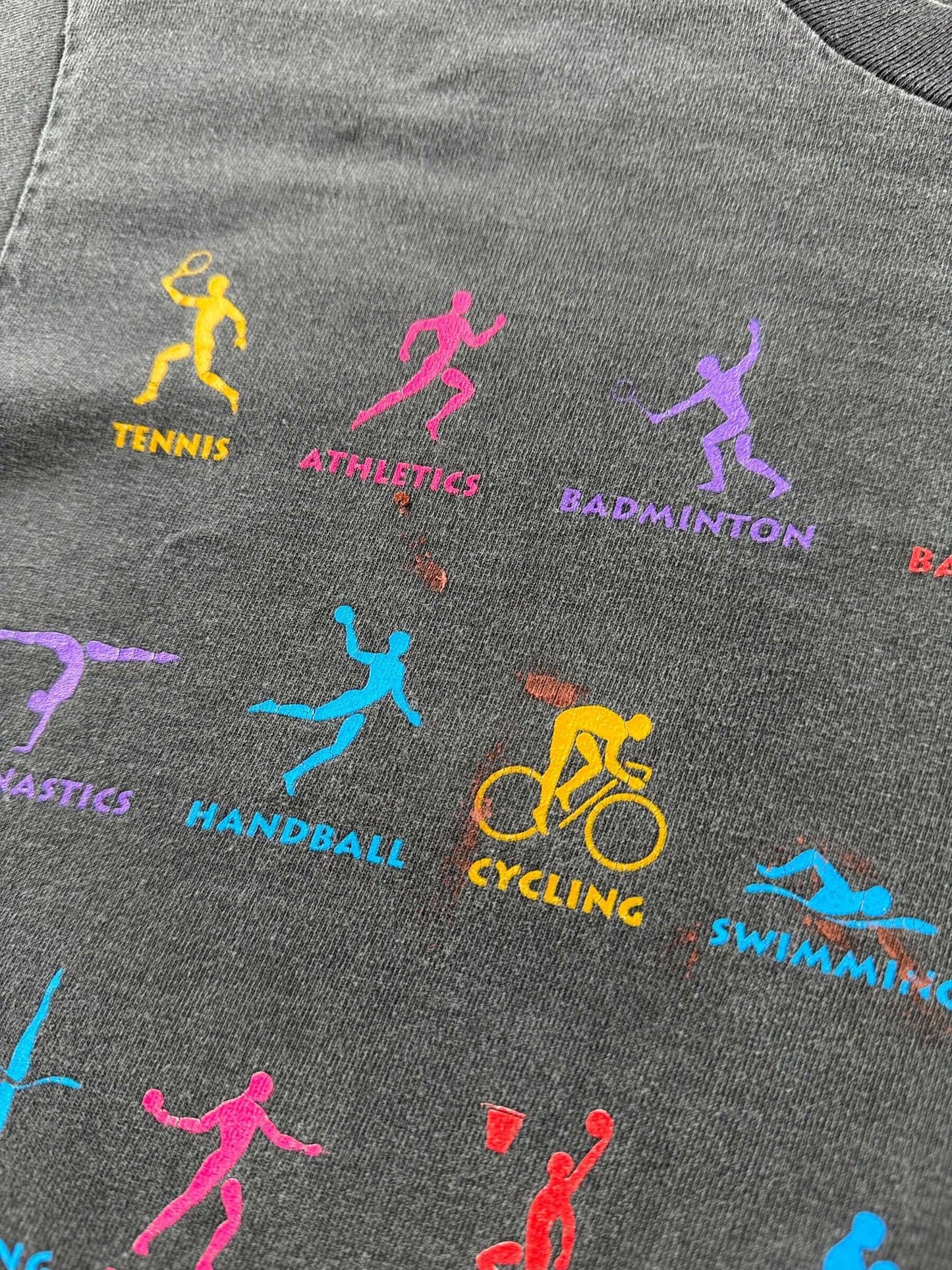 Paint on front of Vintage 1996 Olympics Faded Black Tee SZ M