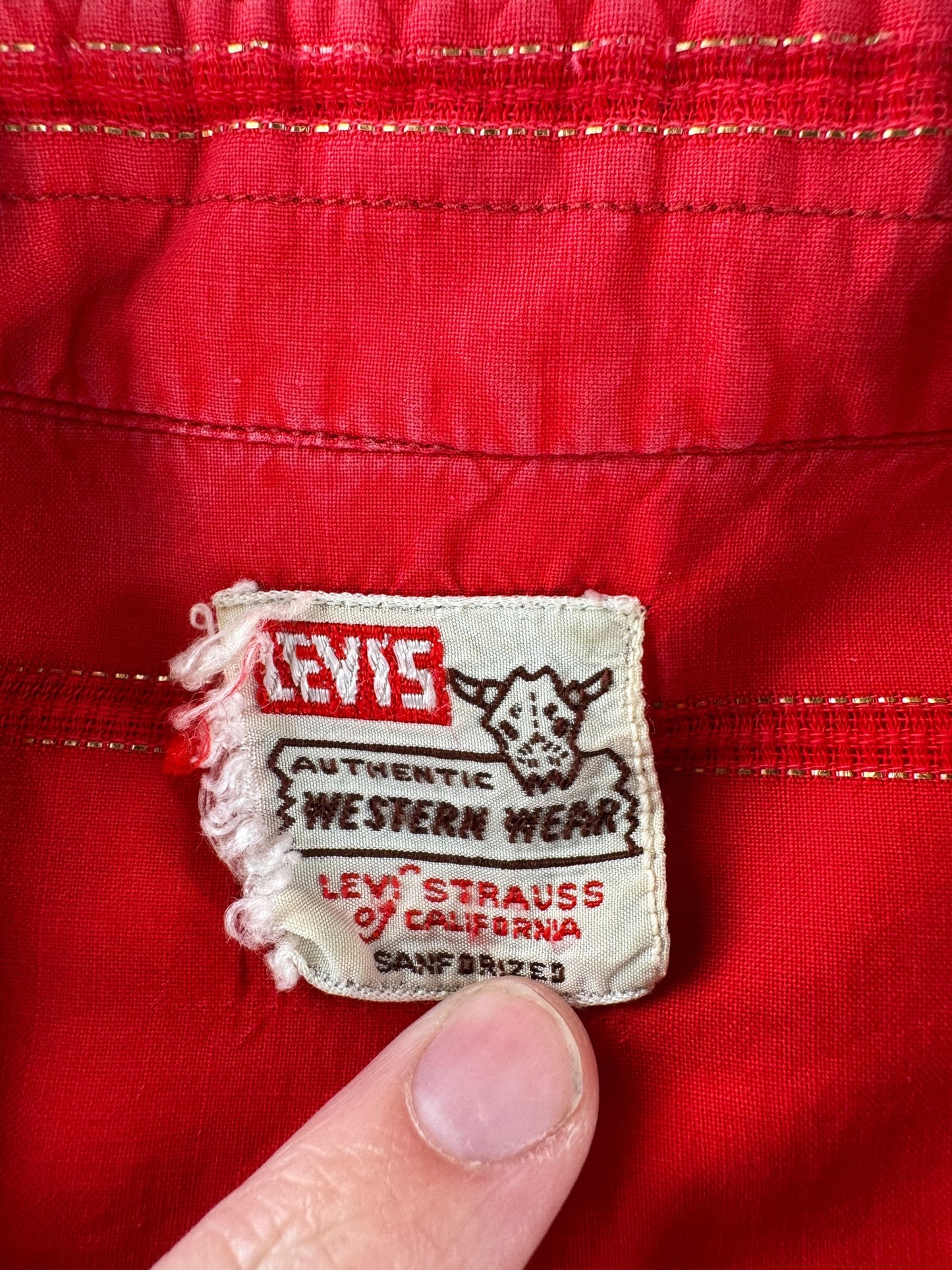 Label on Vintage Levi's Western Wear Red Pearlsnap SZ M
