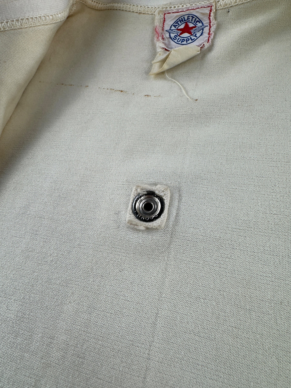 Button on inside of Vintage Athletic Supply Sealth Jersey SZ 44