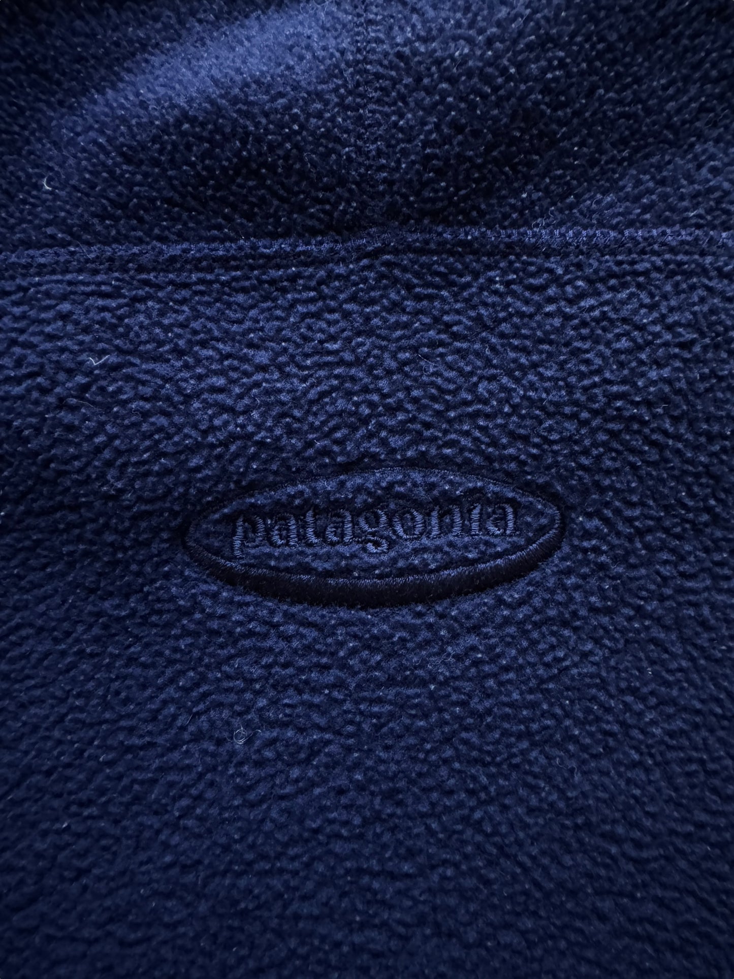 back embroidery of Vintage Patagonia Navy Synchilla Fleece SZ S