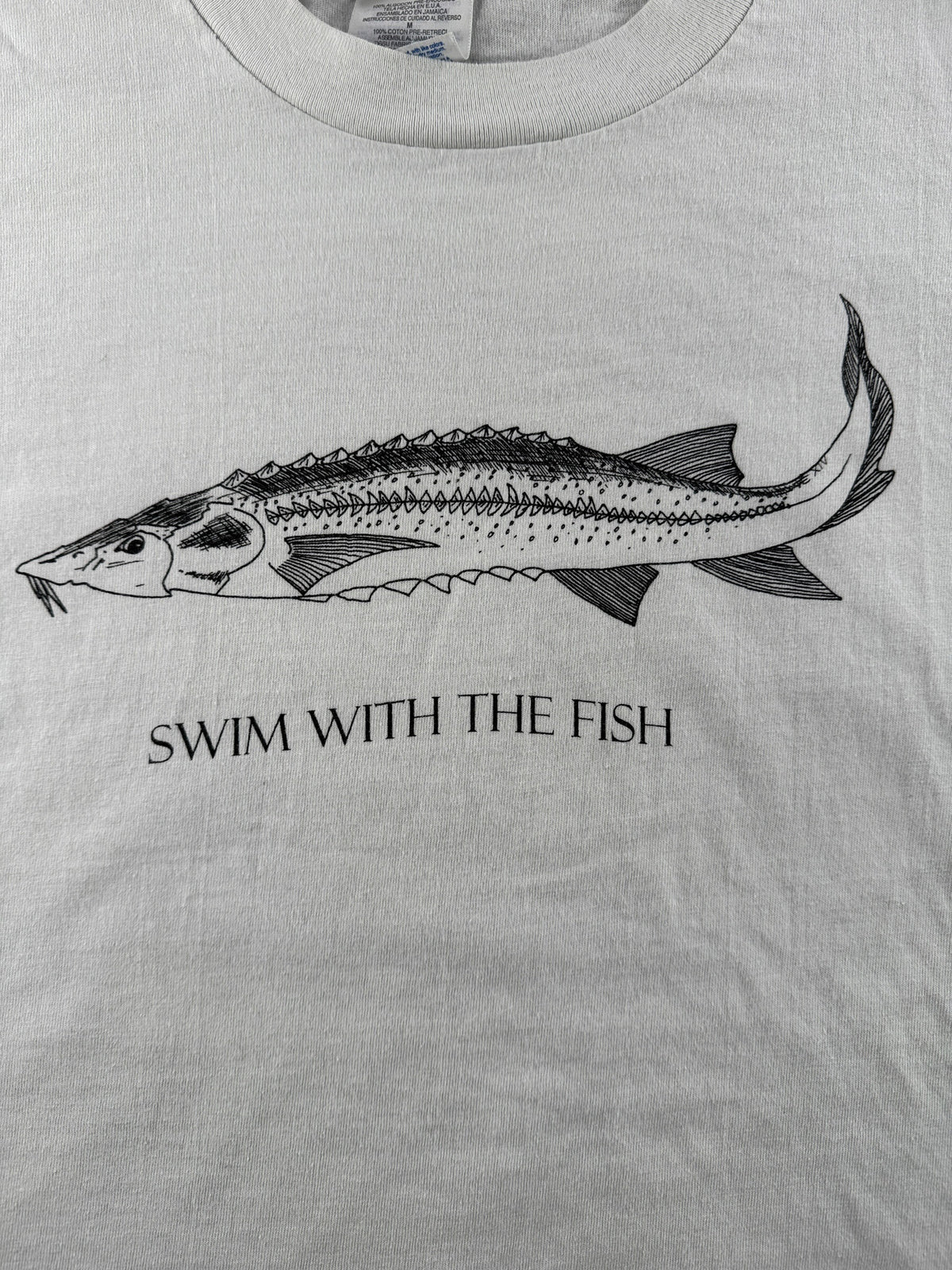 Graphic on Vintage 90s Swim With The Fish Fish Tee SZ M