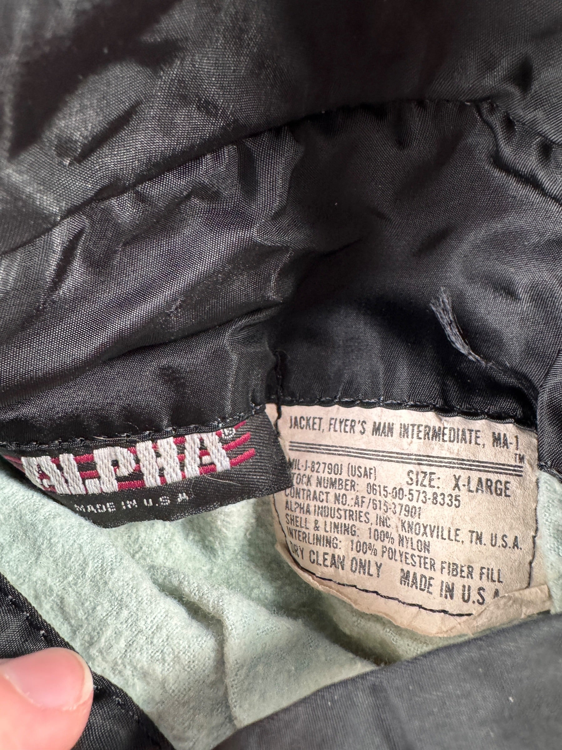 Label on Vintage Alpha Industries Vietnam Era MA1 Bomber Jacket SZ
