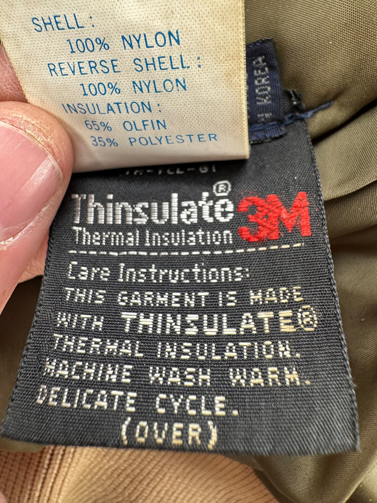 Tags on inner pocket of Vintage Columbia Reversible Hunting Bomber Jacket SZ L