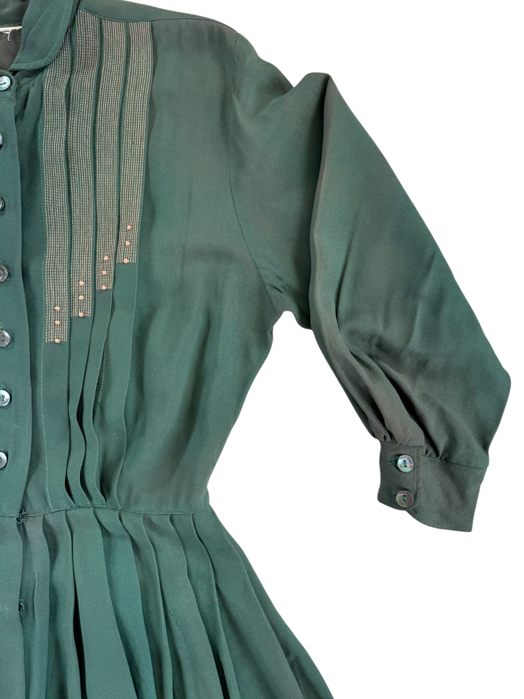 Front left shoulder of 1940s Green Rayon Pleated Dress M