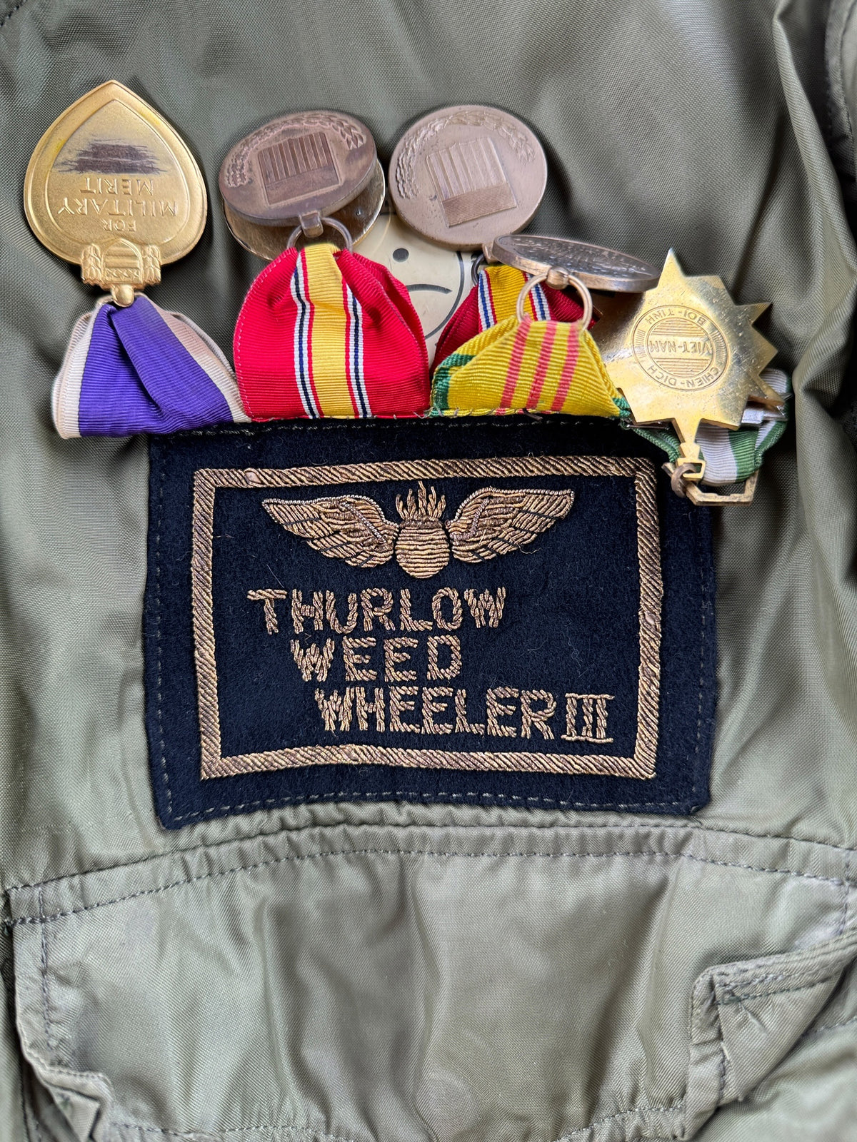 Name tag on Vintage Vietnam Winter Flyers Jacket w/ Patches SZ 46
