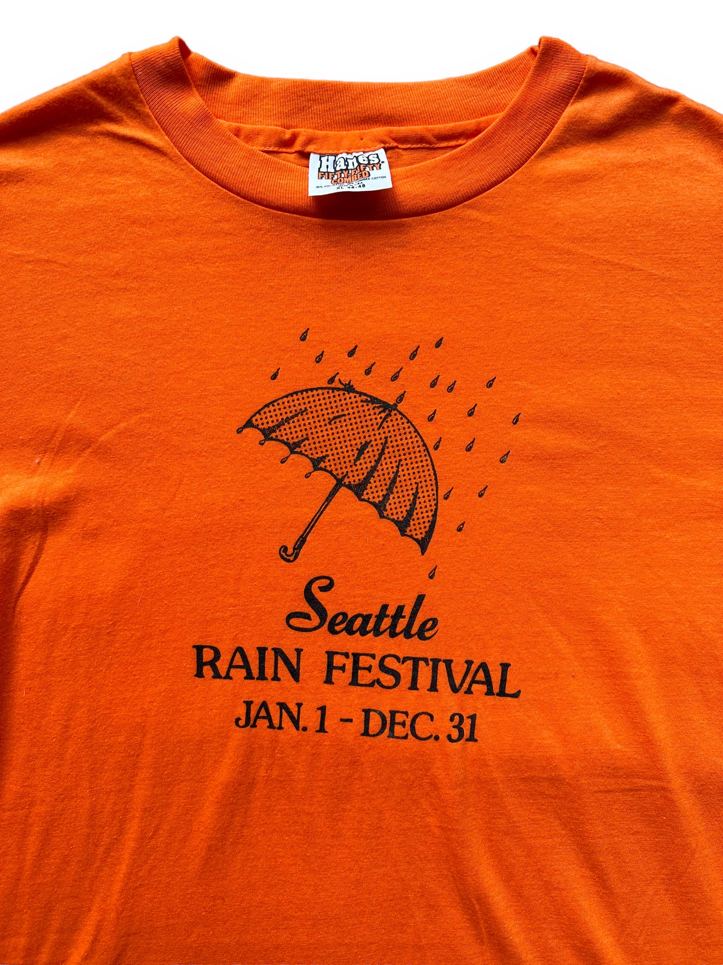 Tag View and Graphic Detail on Vintage Orange Seattle Rain Festival Tee SZ XL | Vintage Seattle Tourist Tees | Barn Owl Vintage Tees Seattle