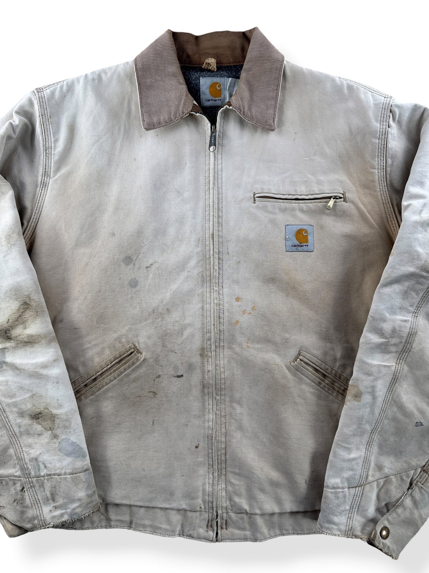 Close-up of Vintage 90’s Carhartt Faded Tan Detroit Jacket SZ XL