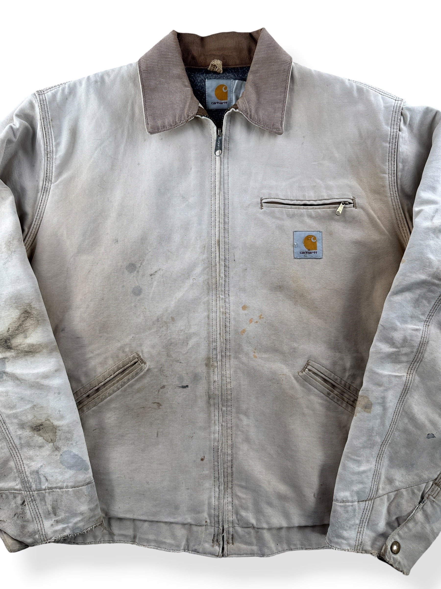 Close-up of Vintage 90’s Carhartt Faded Tan Detroit Jacket SZ XL