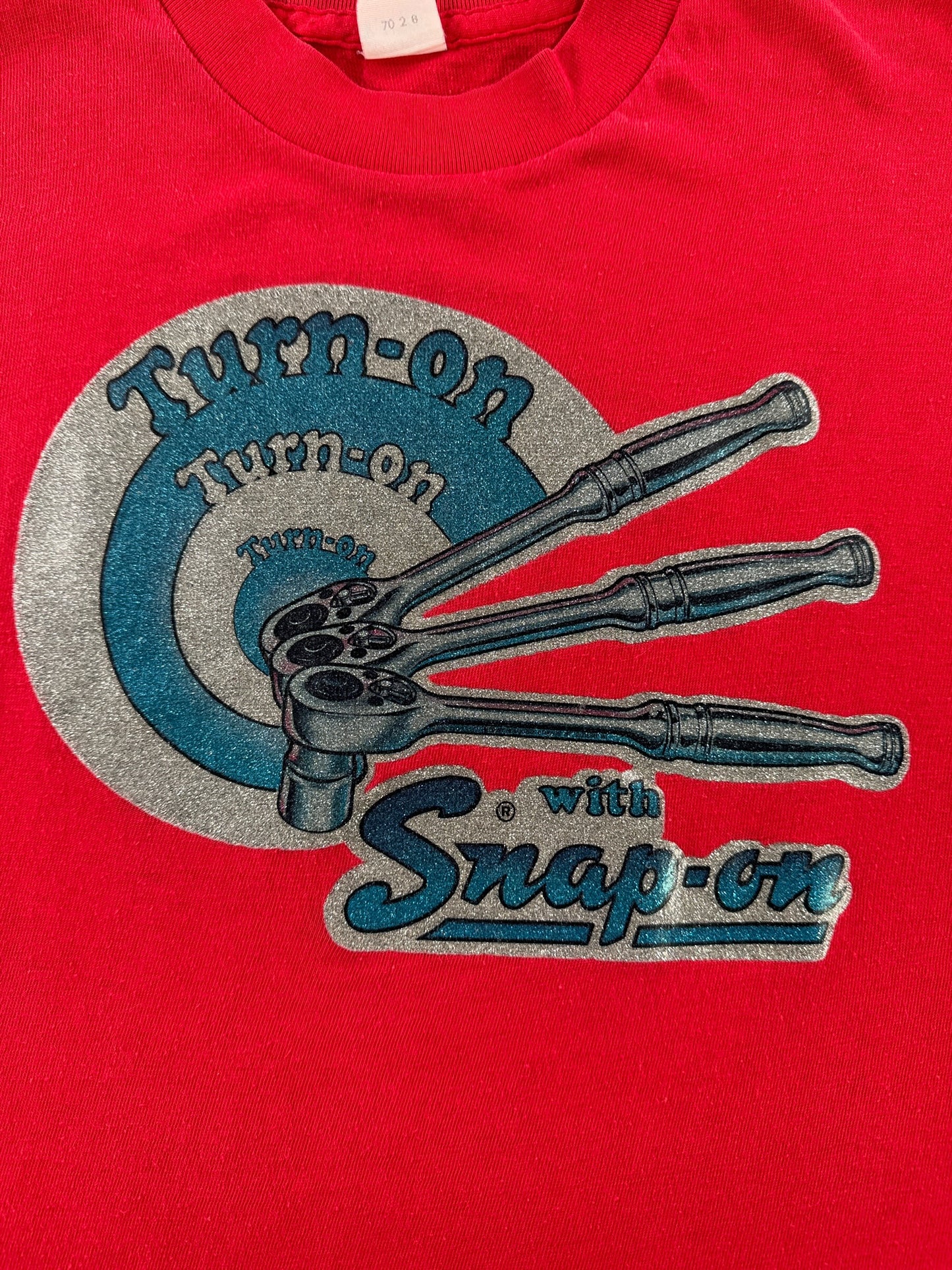 Graphic of Vintage 70s Heat Press Snap-On Tee SZ L (Fits M)