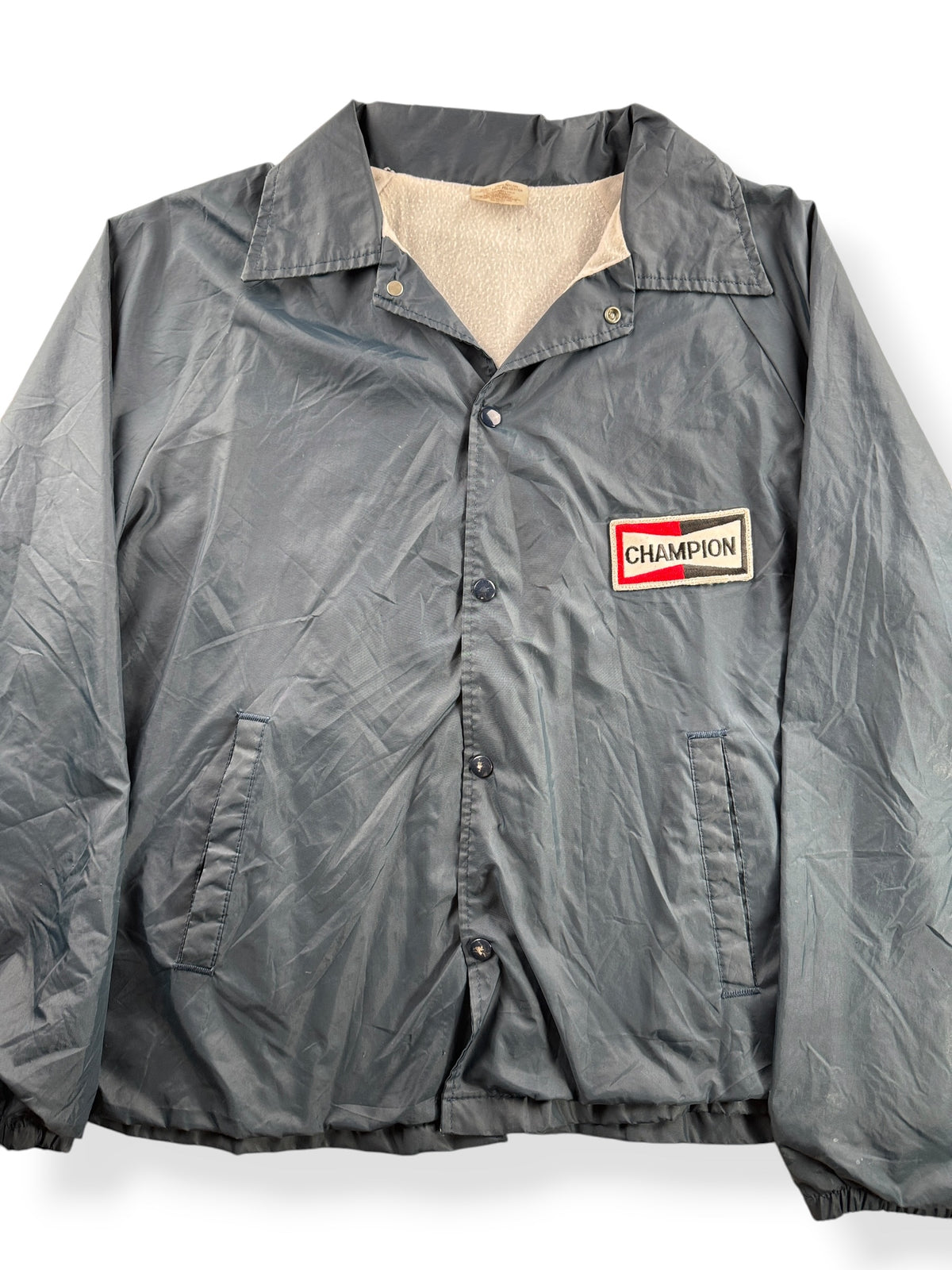 Close-up of Vintage Champion Spark Plug Windbreaker SZ XL