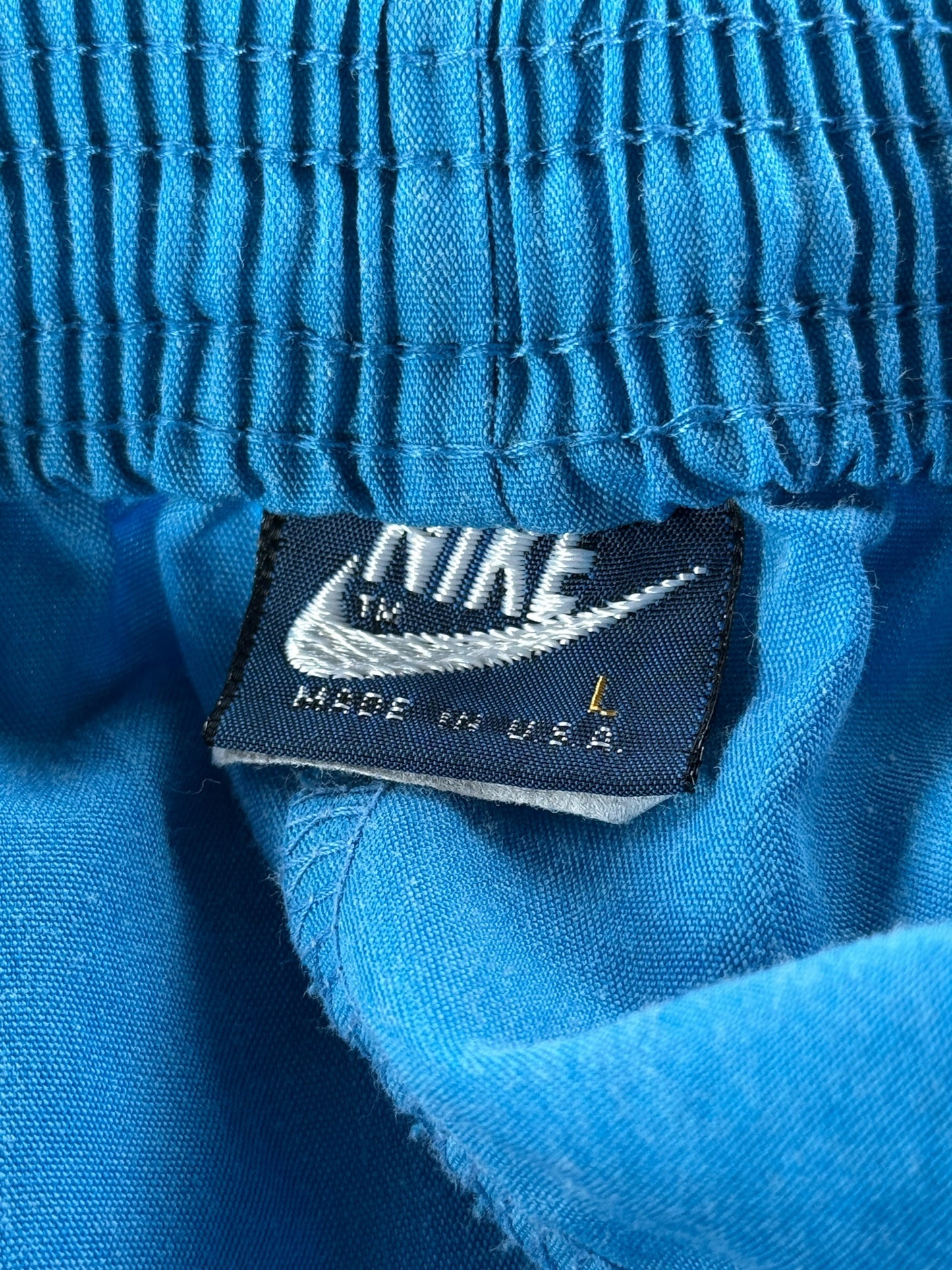 Inner Nike Tag on Vintage 80s Blue Nike Shorts SZ L