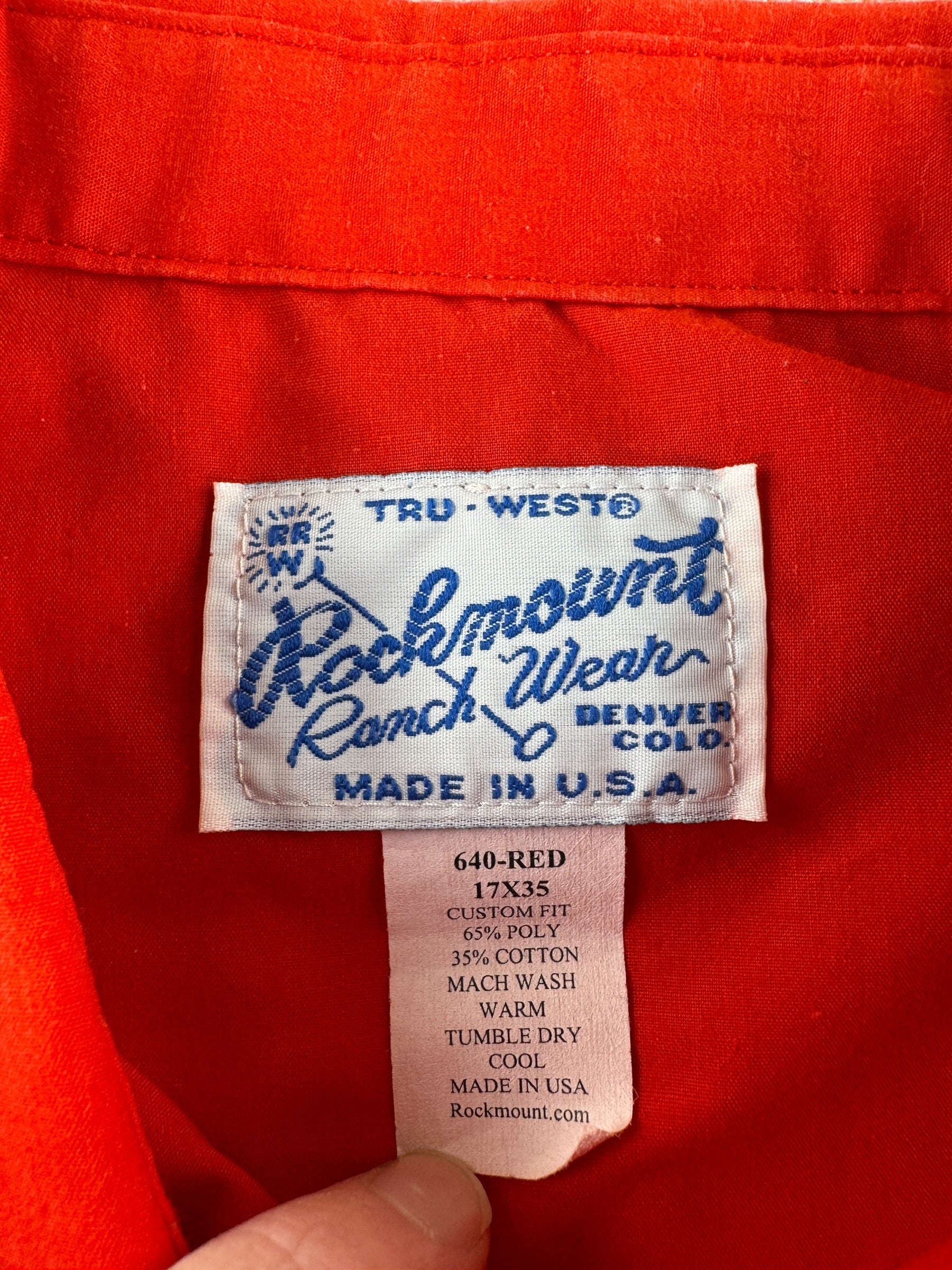 Label on Vintage Rockmount Red Sawtooth Pearl Snap SZ L