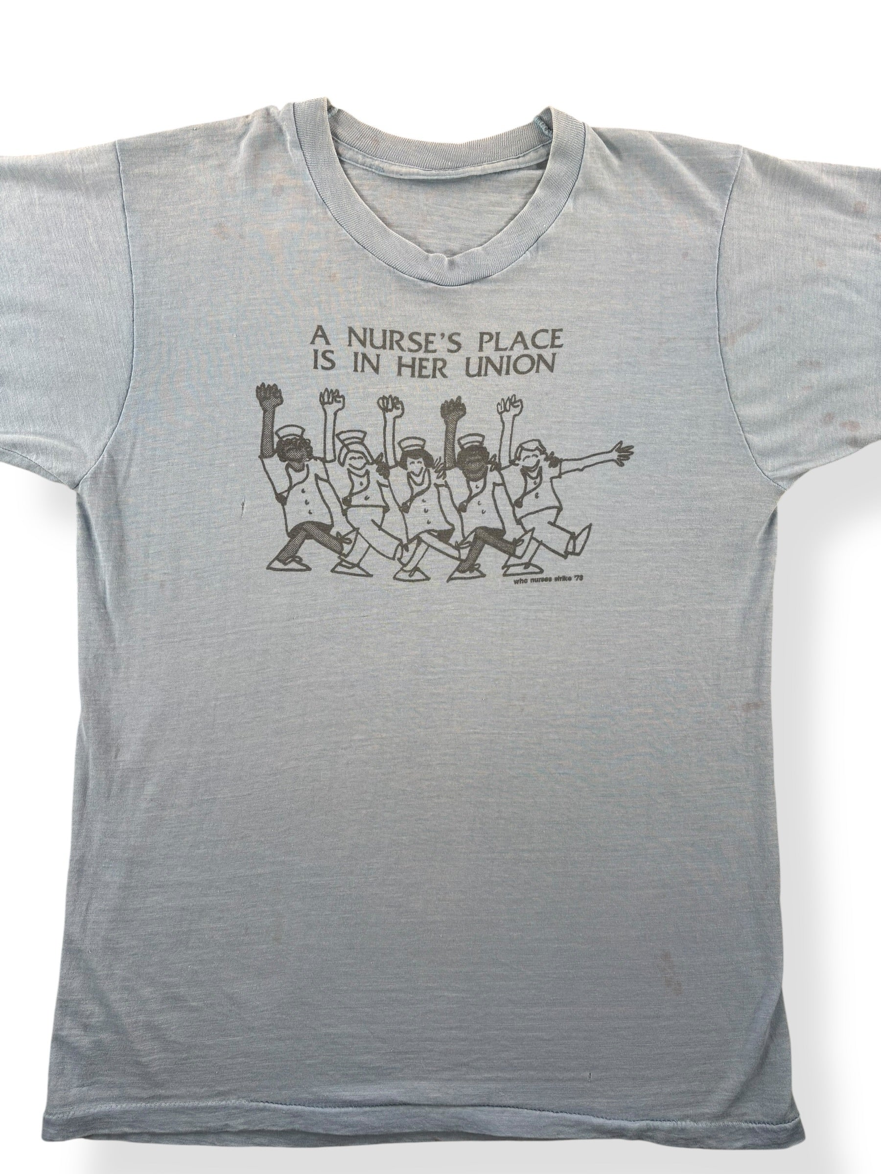 Front Close Up of Vintage A Nurse's Place Is In Her Union Tee SZ M