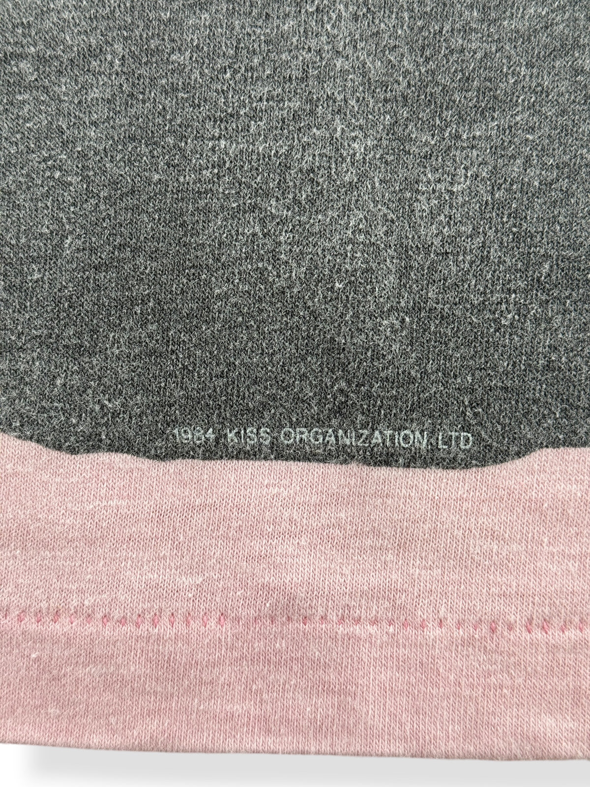 Copyright on Graphic of Vintage 80s Kiss 'Slave Girl' Pink Longsleeve Baby Tee SZ S