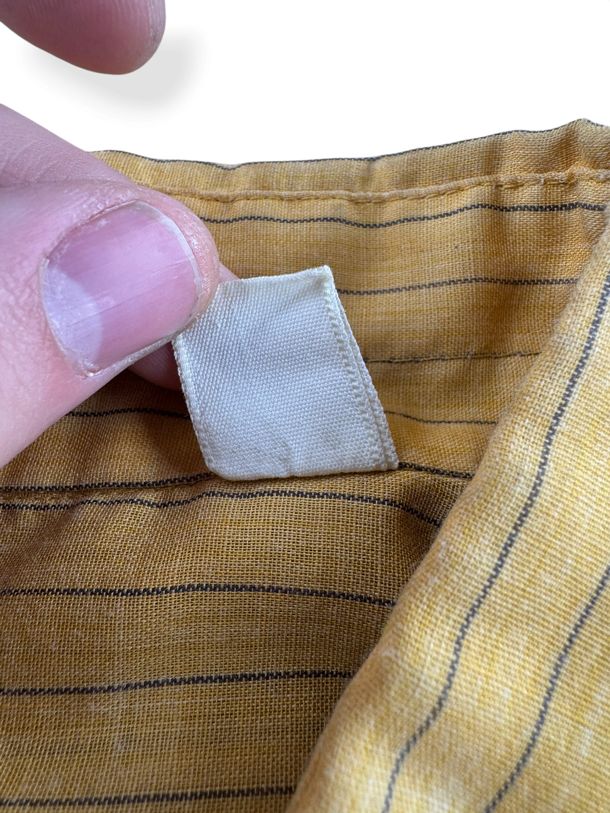 Back of tag on Vintage 70s Yellow Striped Shirt W/ Chopped Sleeves SZ L
