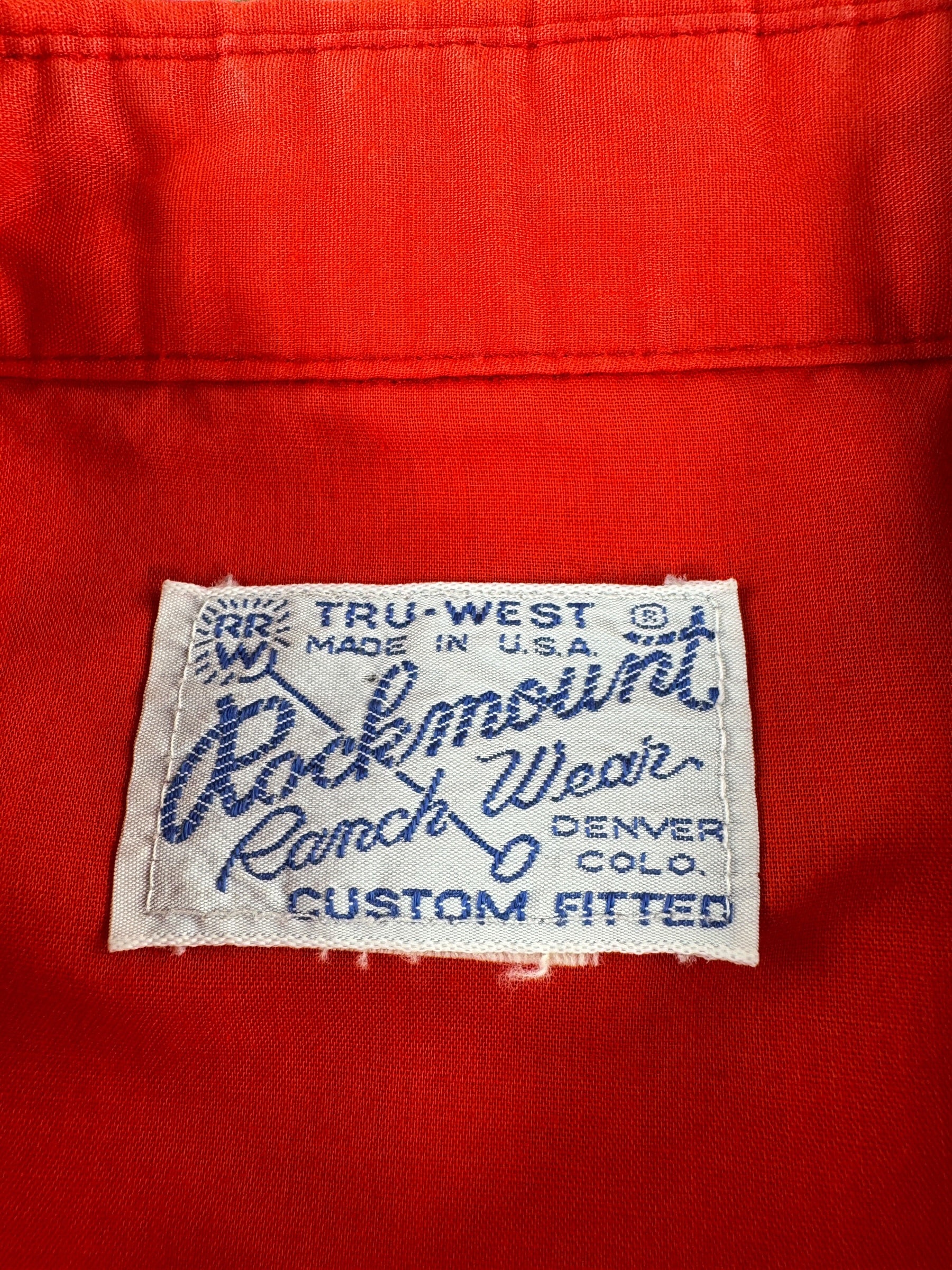 Label on Vintage Red Rockmount Western Wear Pearl Snap SZ L