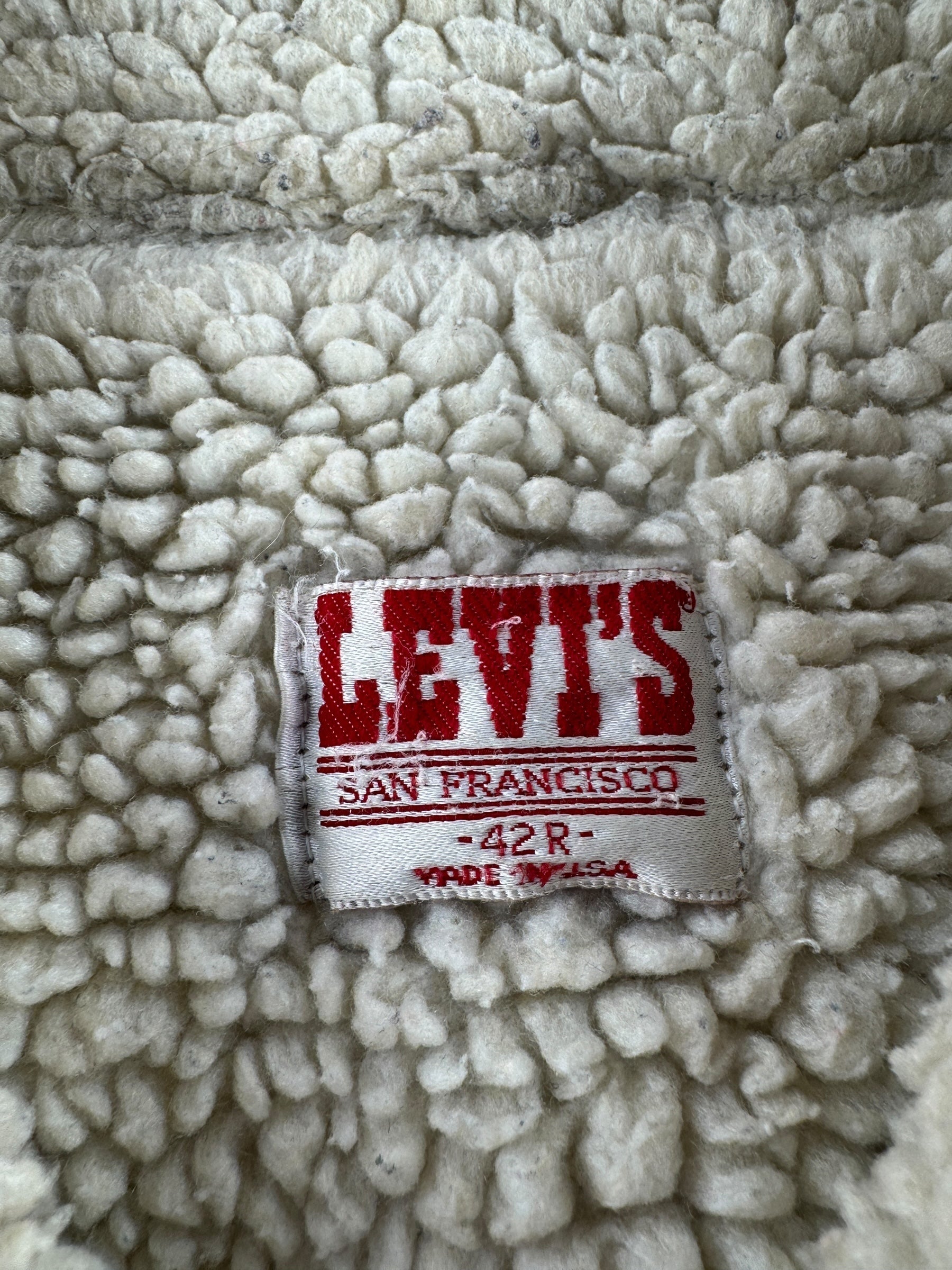 Label on Vintage Light Wash Levis Shearling Denim Trucker Jacket SZ 42