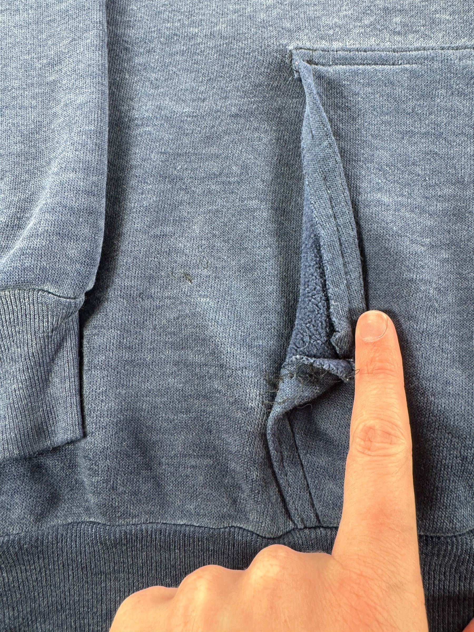 Undone Seam of Pocket on Vintage Faded Blue Gussetted Hoodie SZ L