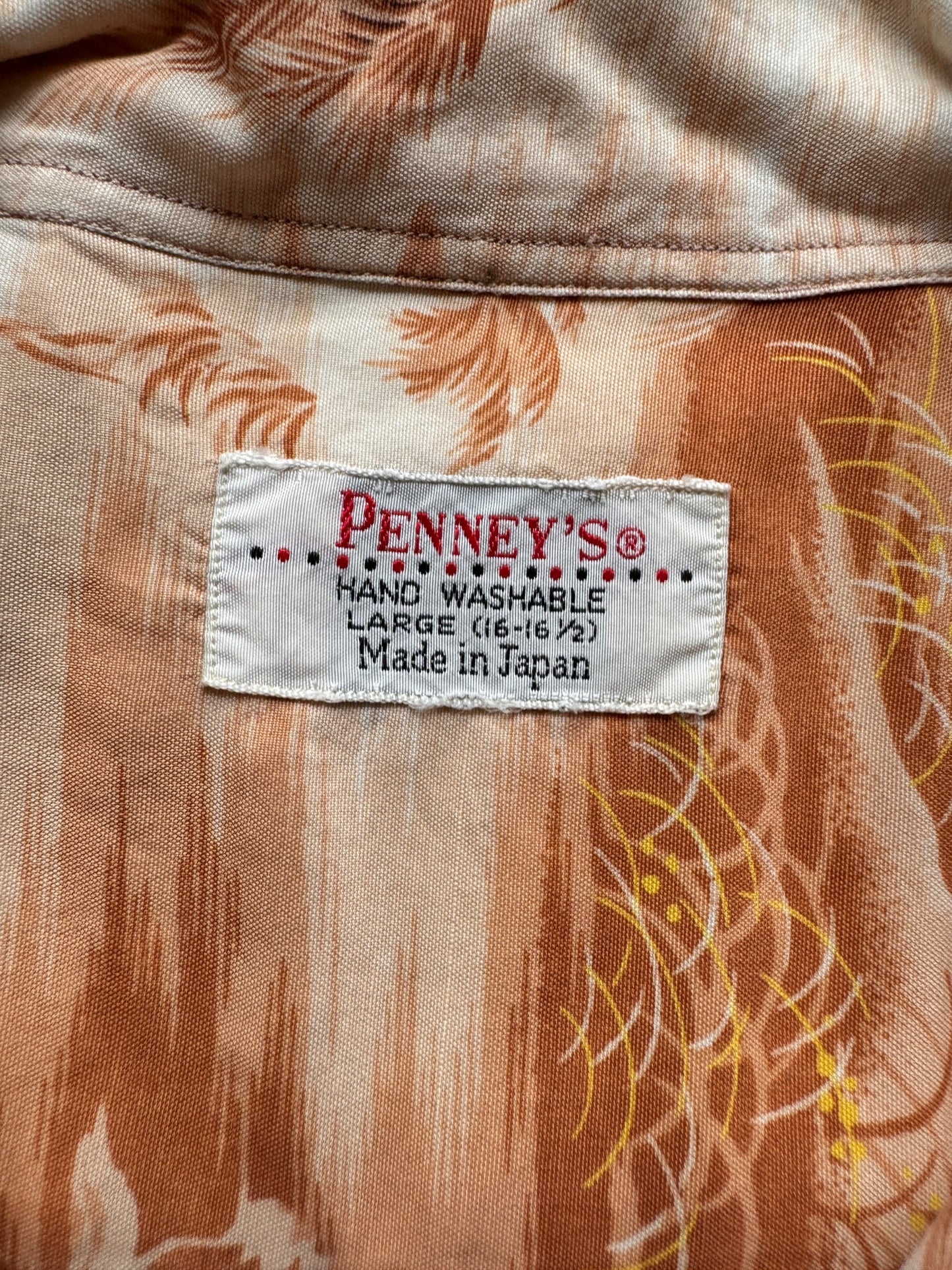 tag on Vintage Made in Japan Orange/Brown Palm Tropical Scene Penney's Aloha Shirt SZ L