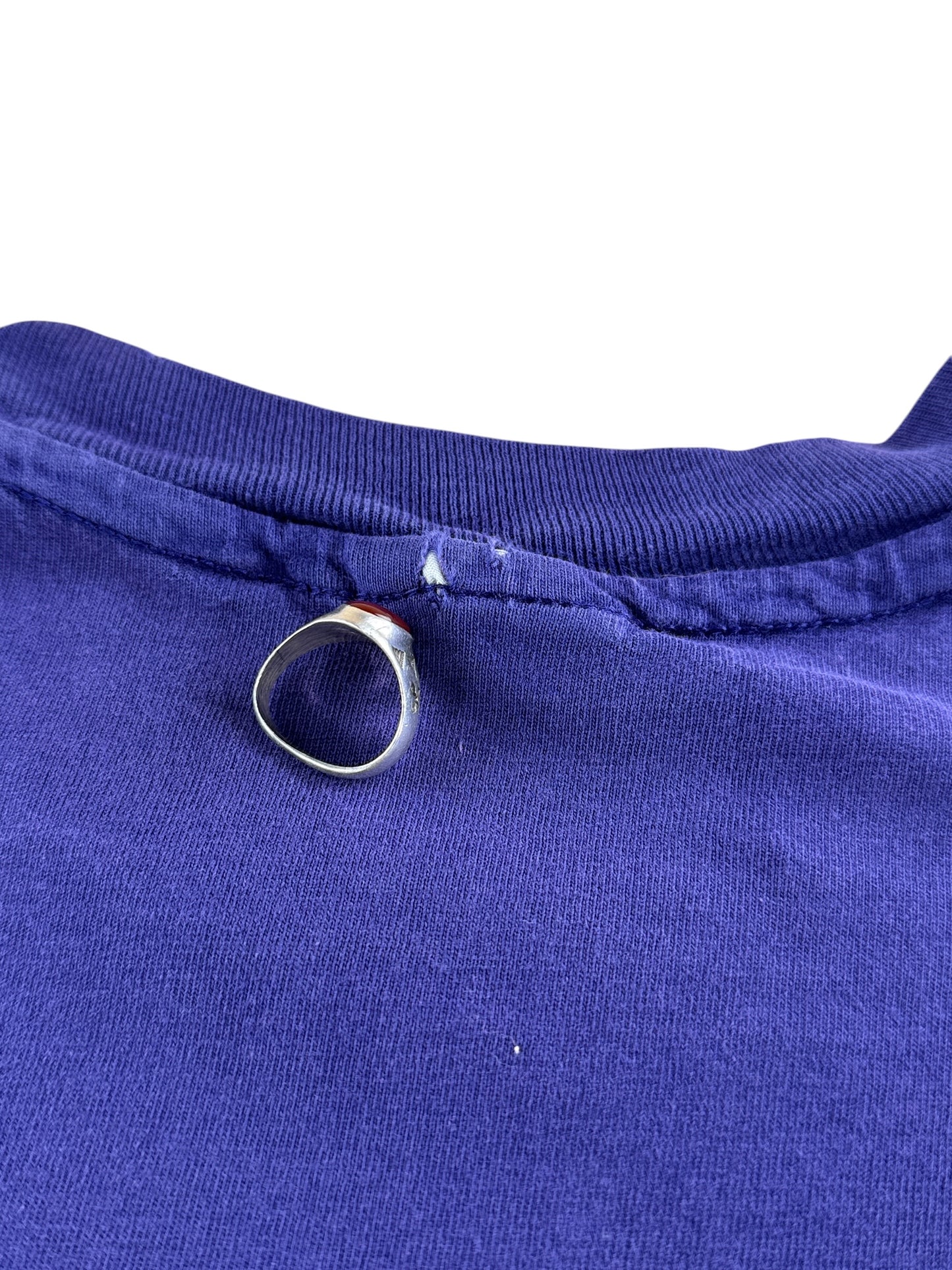 Small hole on back collar of Vintage Purple Kismet Tee SZ L