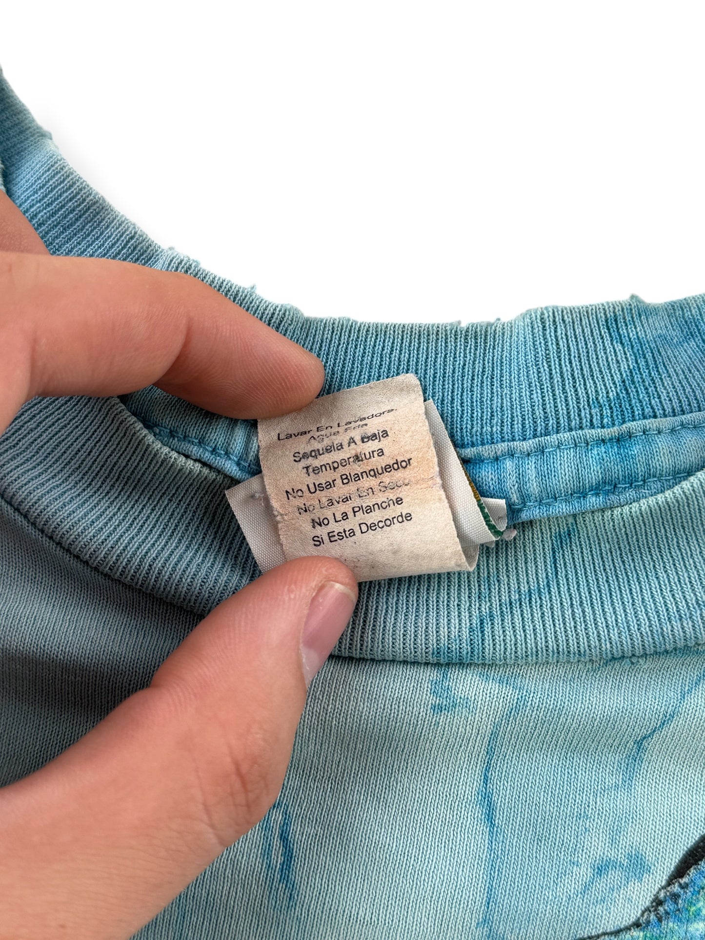 Other side of other tag on Vintage AOP Rainforest Cafe Lizard Tee L - AS IS
