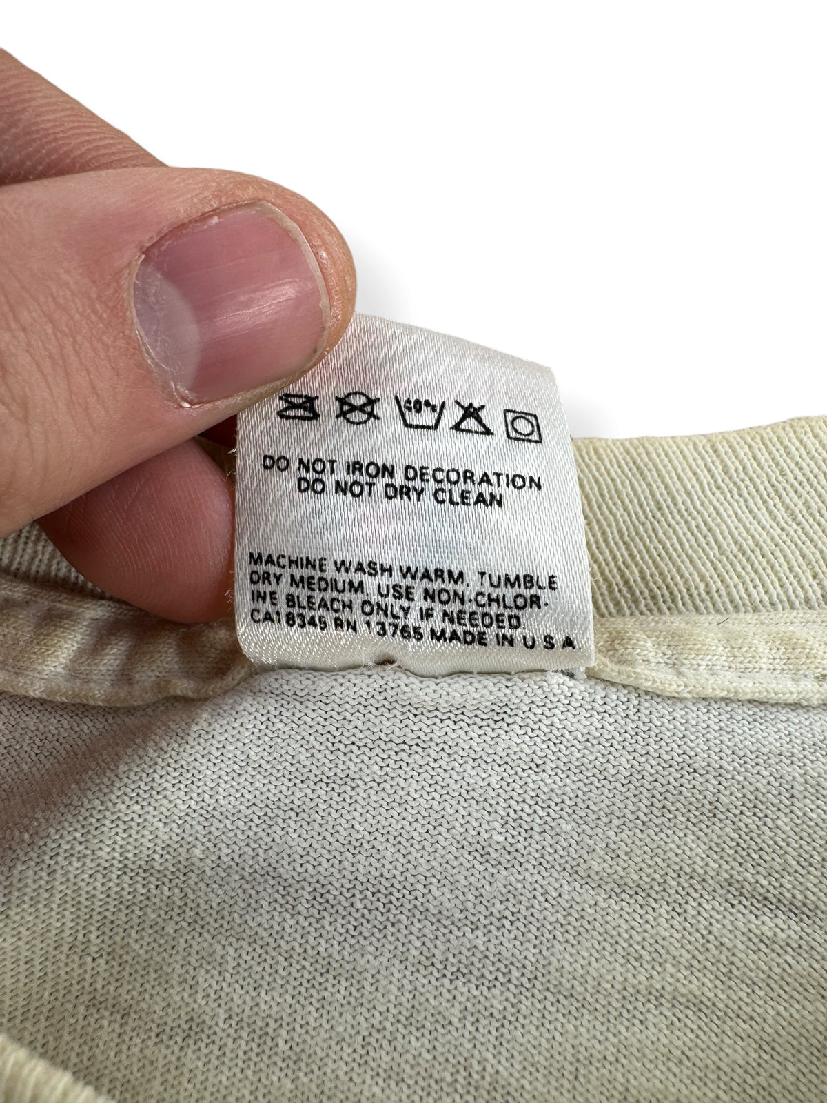 Back of tag on Vintage John Wayne Tee SZ L - AS IS