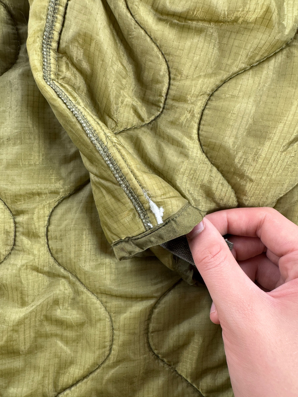 Ware on cuff of Vintage Military Parka Liner Jacket SZ M