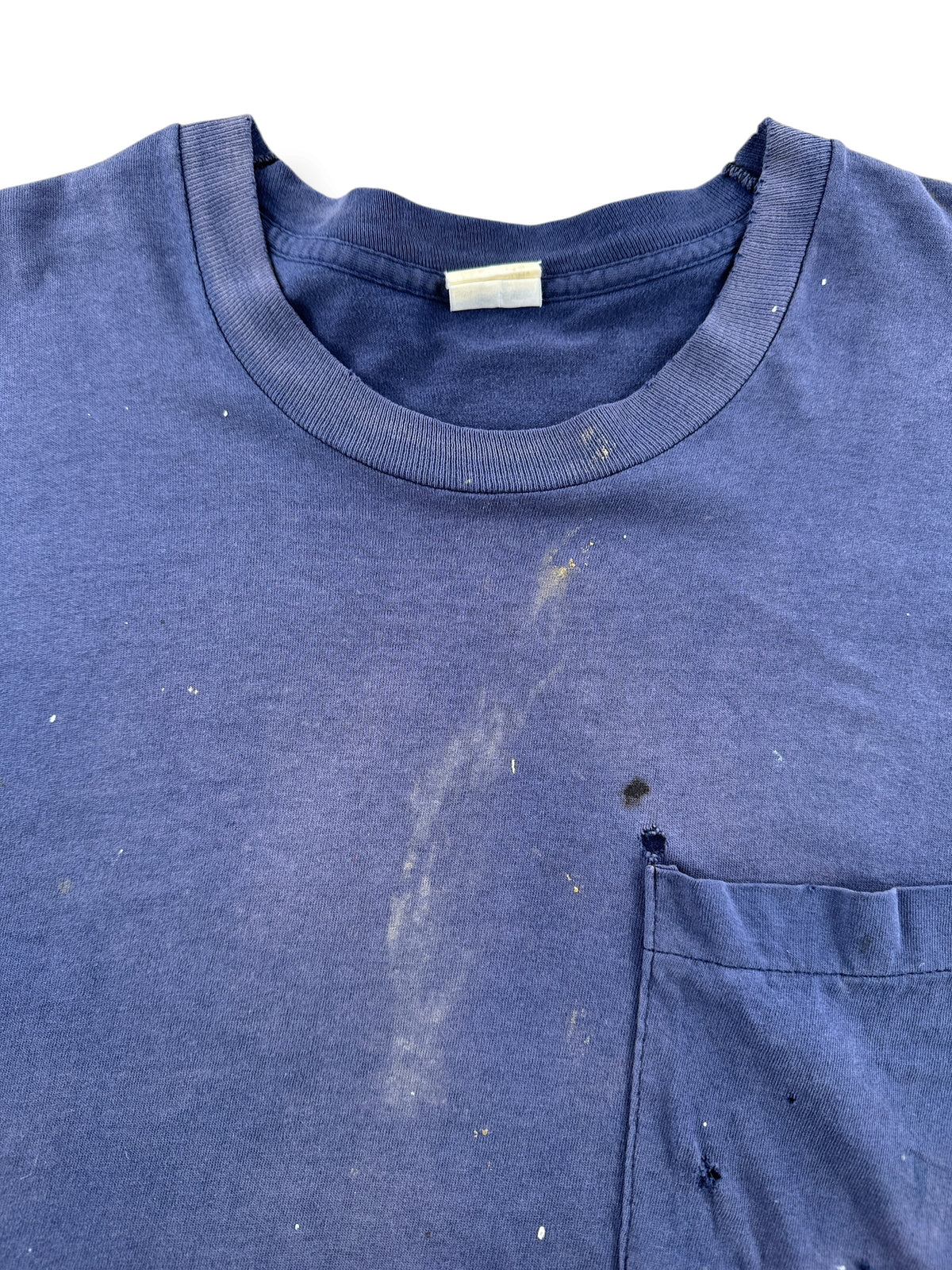 Wear on front of Vintage Distressed Navy Blue Pocket Tee SZ L