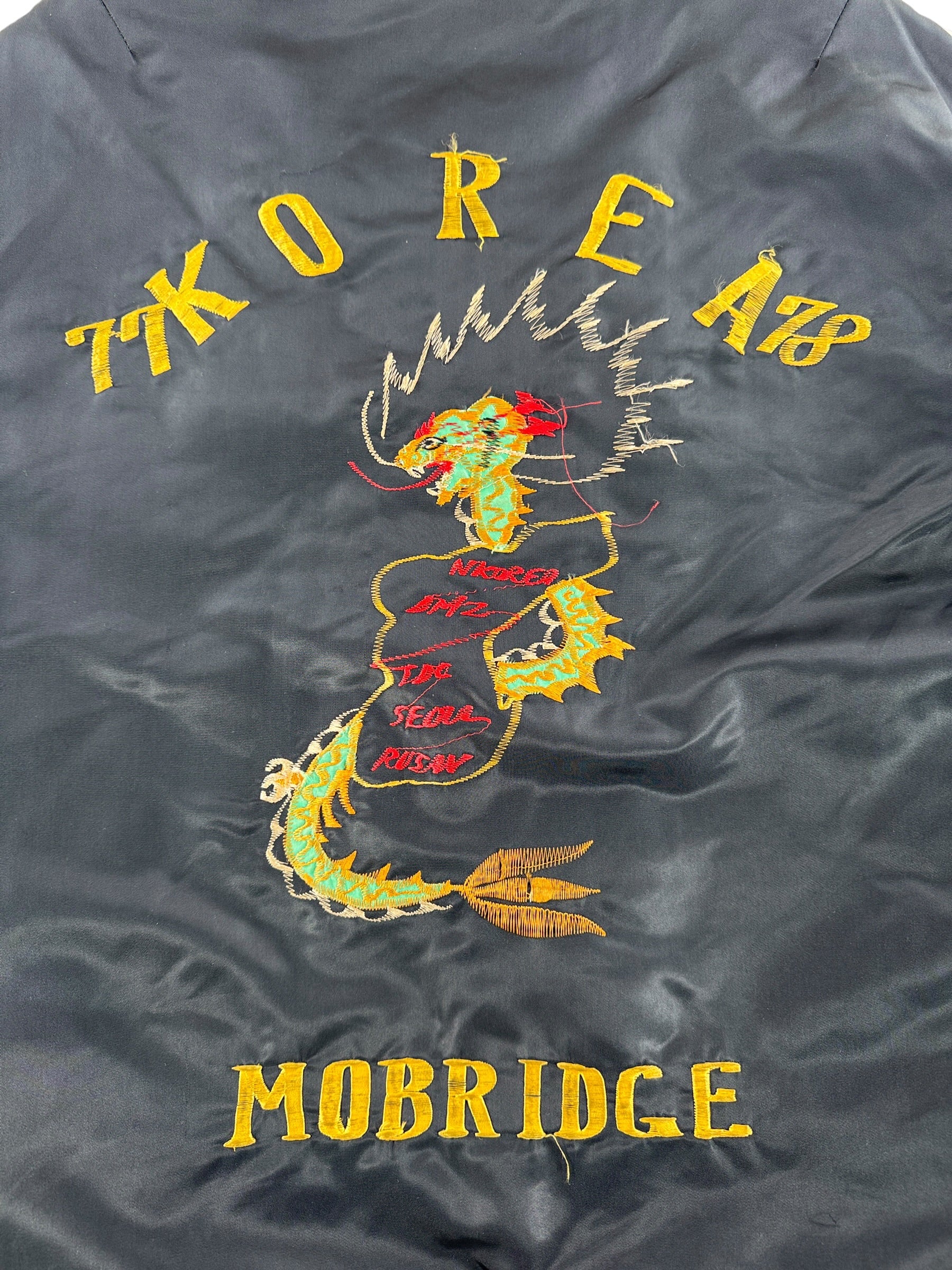 Close up of back embroidery on Vintage '78 Korea 'Troy' Souvenir Jacket SZ L - AS IS