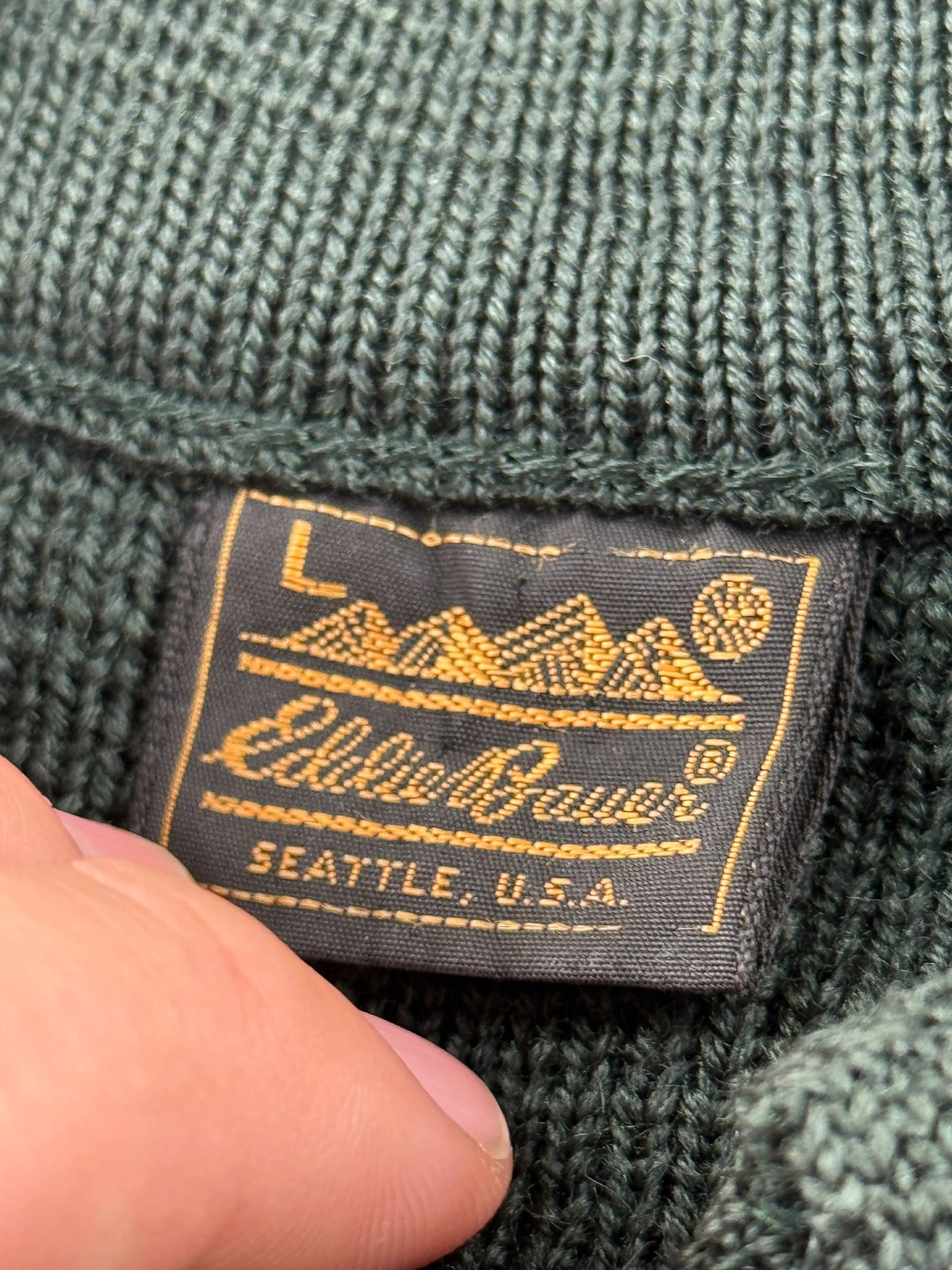 Close-up of tag on Vintage 80s Era Eddie Bauer Wool Sweater SZ L - AS IS