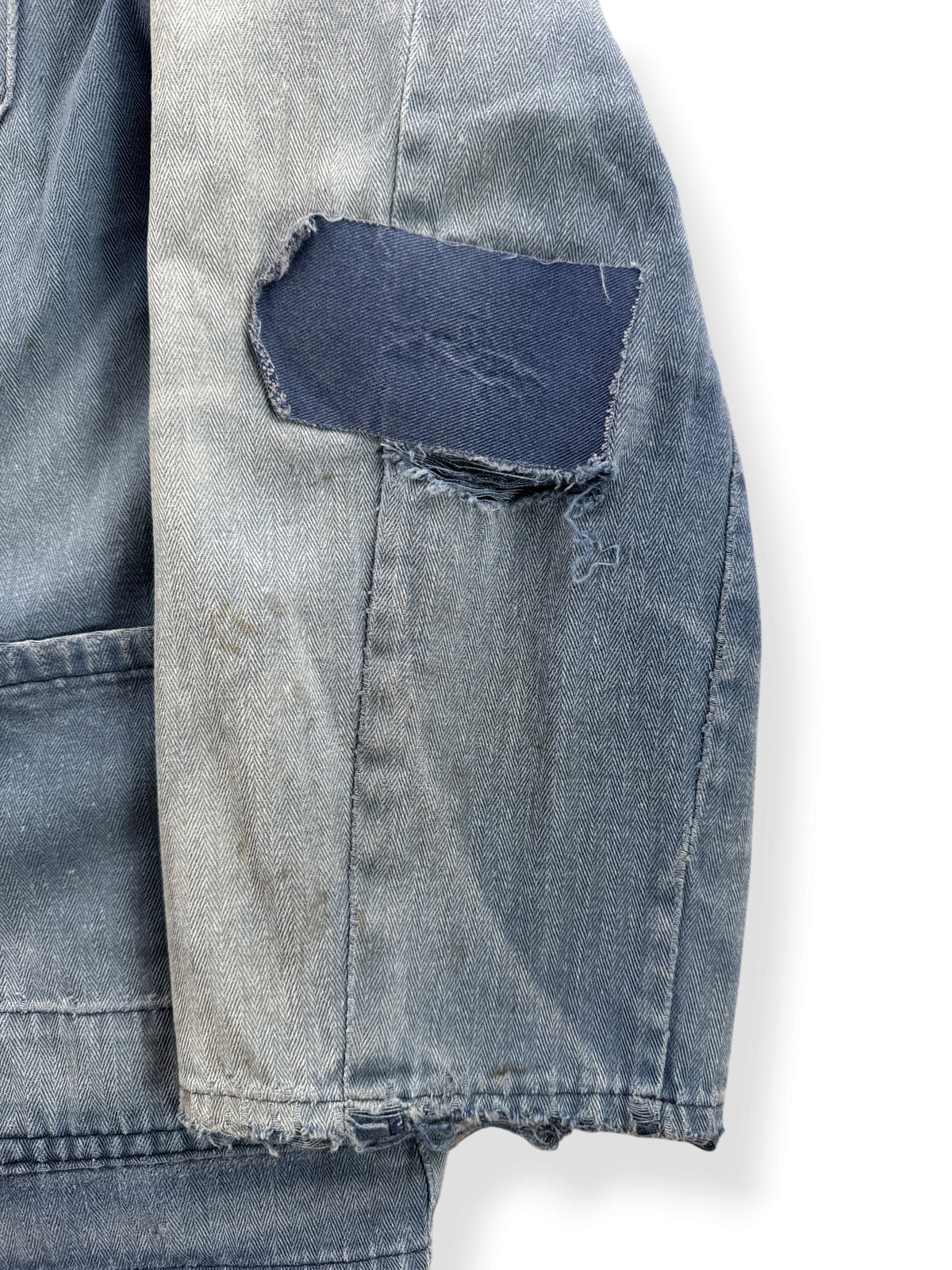 Repairs and fading on sleeve of Vintage Distressed French Chore Coat SZ L
